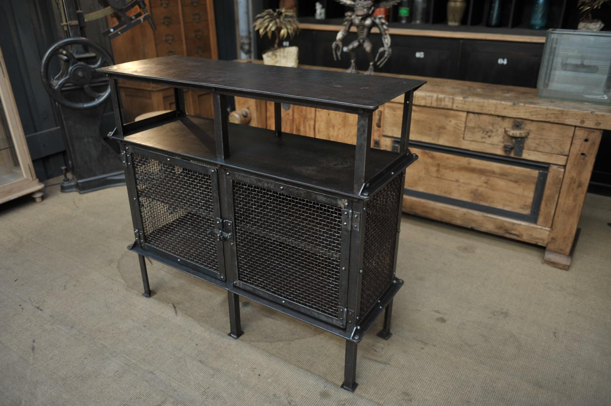 Mesh riveted iron Industrial cabinet from SNCF French rail way workshop with 2 doors and 6 feet, circa 1940.