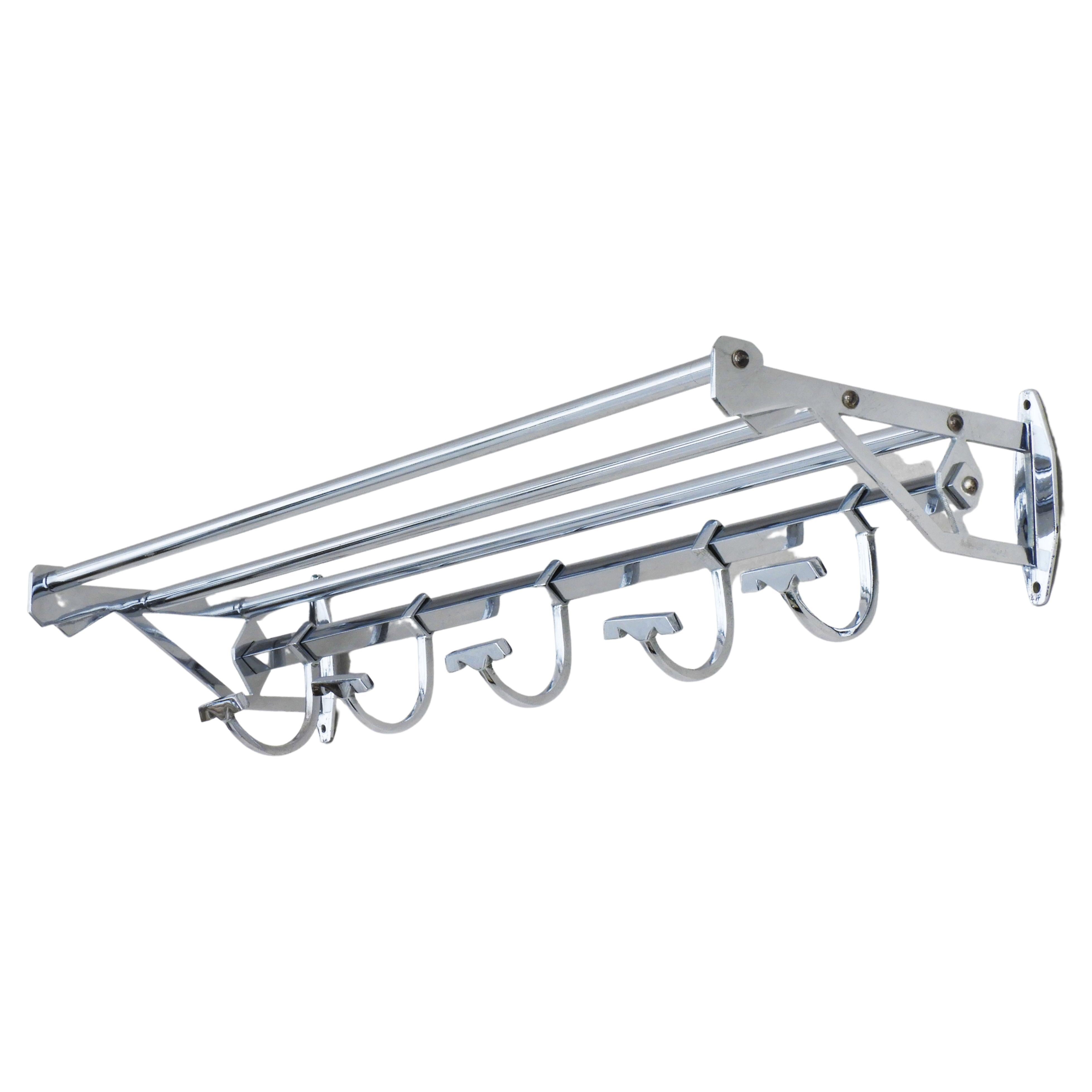 French railways chromed hat and coat rack C1950
Classic french Mid century design, both practical and stylish, with five sliding hooks and an upper railed rack for hats or parcels.  Perfect for use in either a cloakroom or bathroom. In good vintage