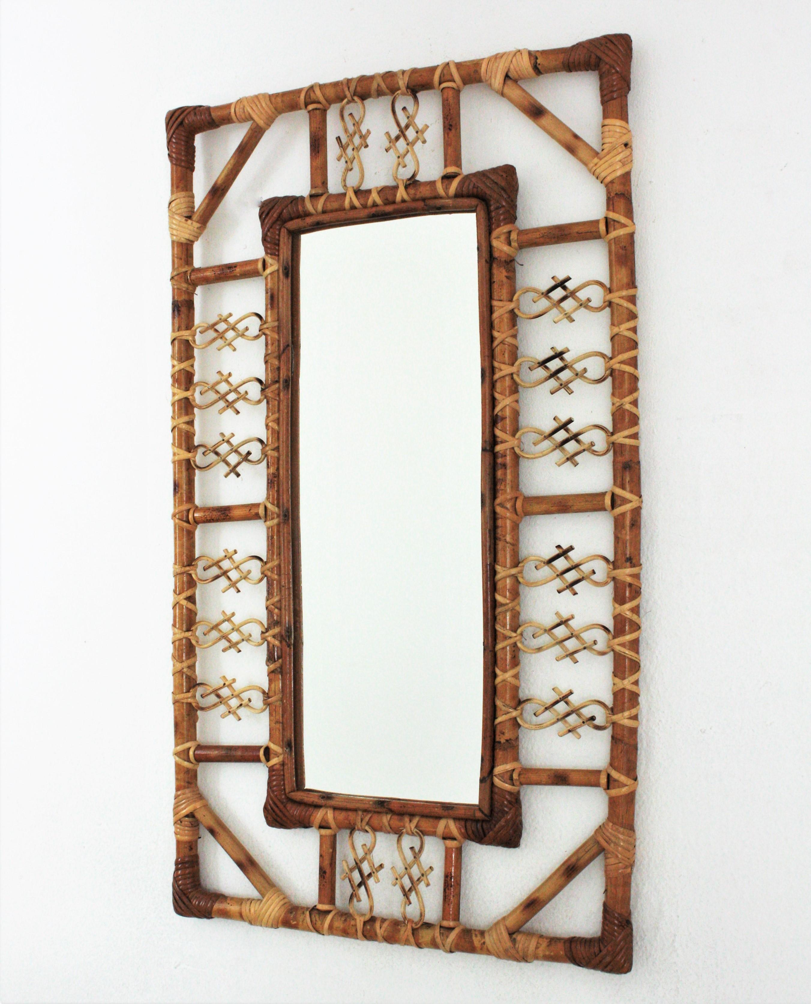 Midcentury rectangular mirror, rattan, bamboo. France, 1960s.
The mirror has chinoiserie and bamboo decorations on the frame and joining the corners. 
It will be eye-catching in an entry hall, bathroom or bedroom and it will add a midcentury