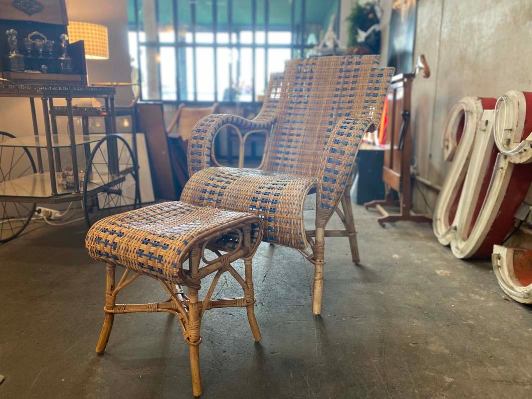 French rattan armchair with ottoman, Art Nouveau.

The armchair has a high back and wide armrests, which are made entirely of rattan weave. The beautiful curved design promises coziness and at the same time is typically French. The special and