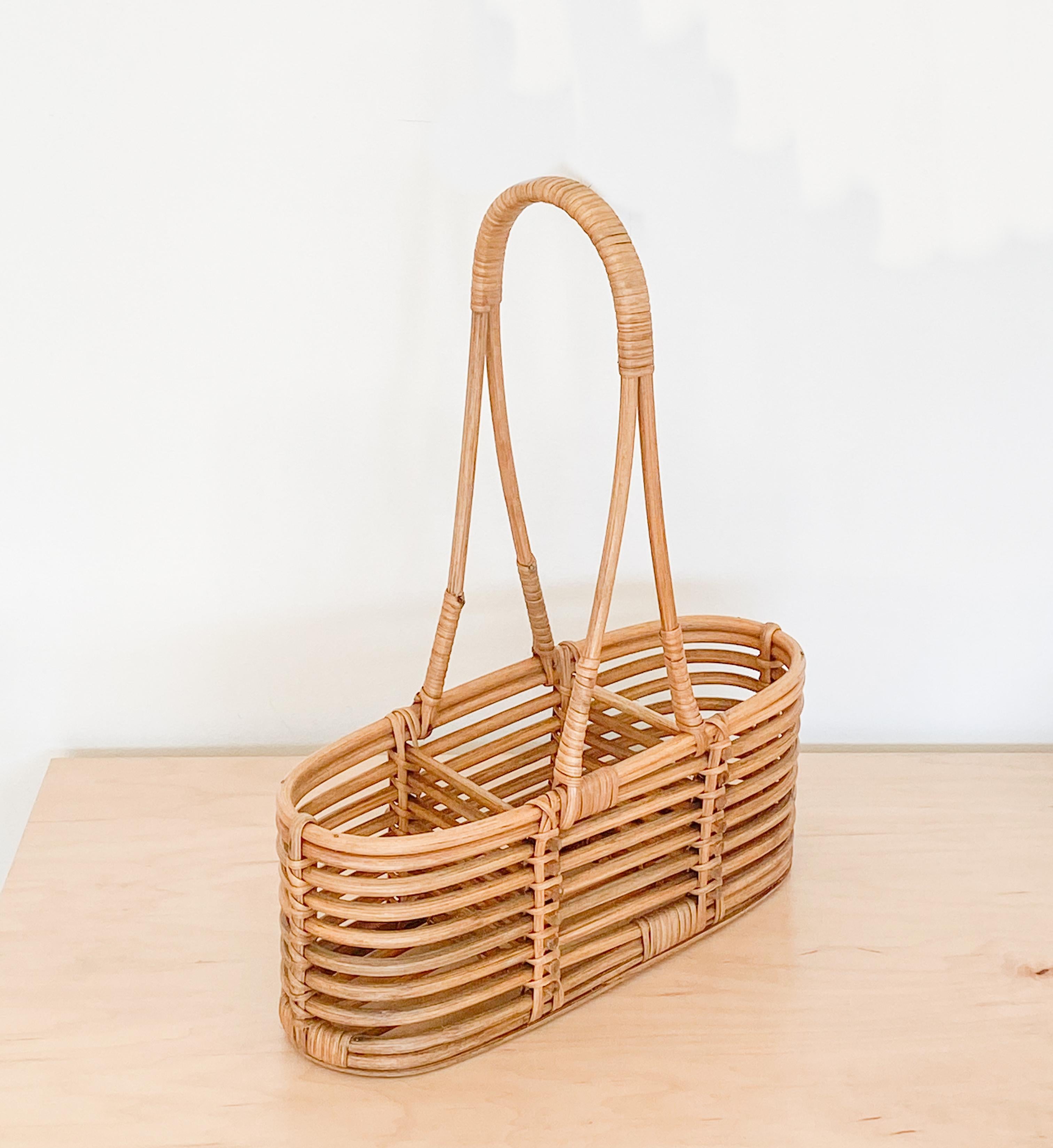 French rattan bottle holder with three compartments and carrying handle. Great original finish. Perfect for bottle display or to carry wine on-the-go.