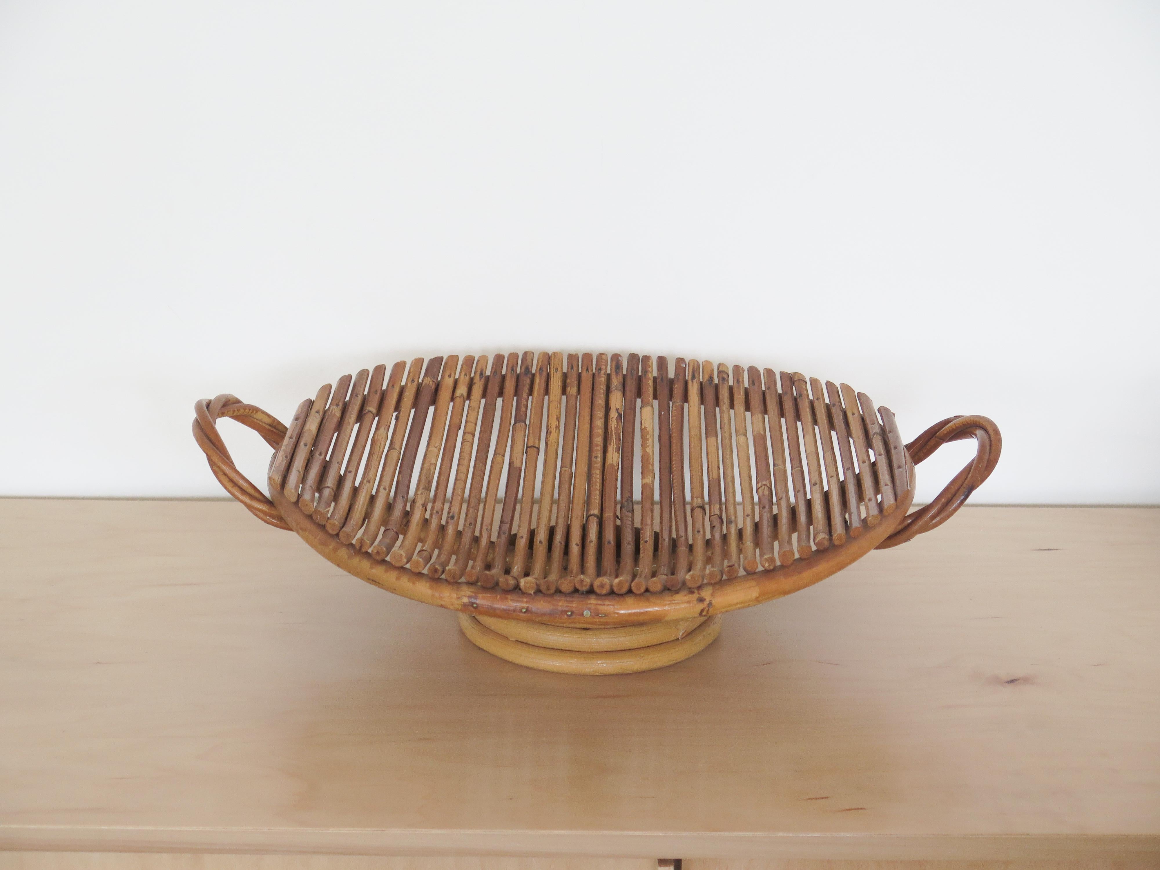 Rattan tray with two side loop handles and small-footed base, perfect for display or holding fruit. In great original condition from France.