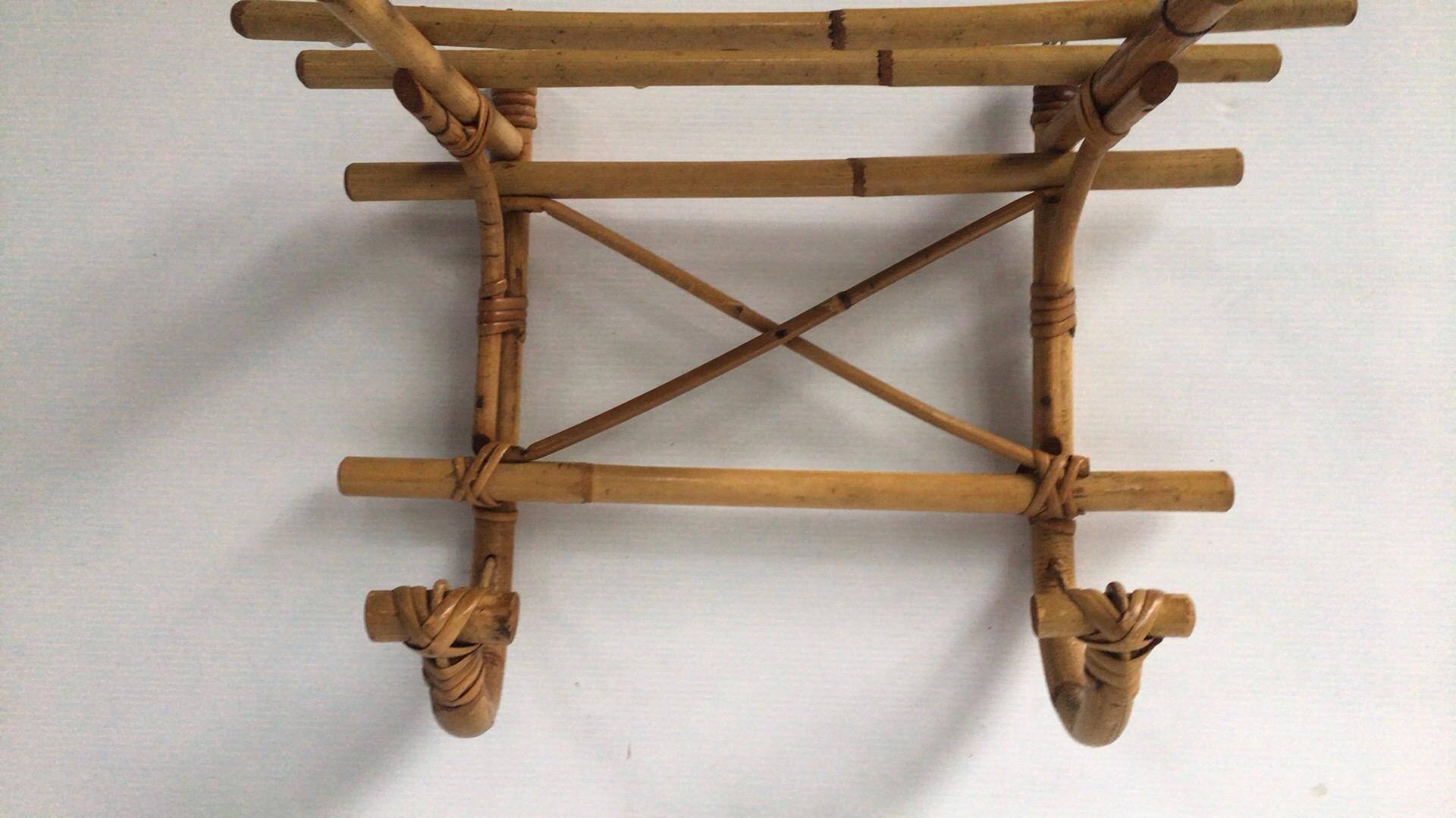French rattan coat rack Louis Sognot, circa 1950.
Height / 12.5 inches.
Depth / 9.5 inches.
Width / 16 inches.