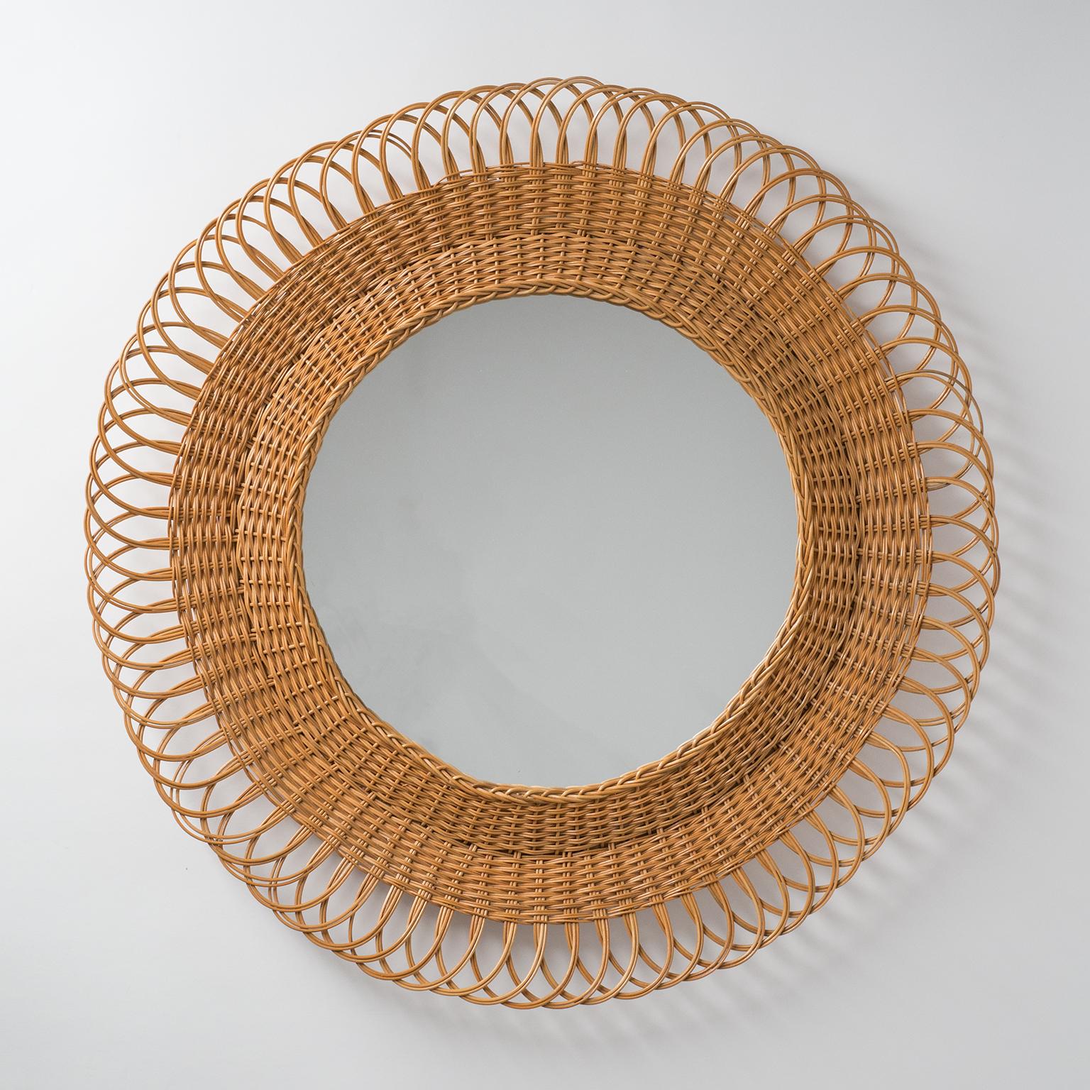 Good-sized French artisanal rattan mirror from the 1960s. Very nice intricate design with an organic feel.
Visible mirror area is 14.5inches/37cm.