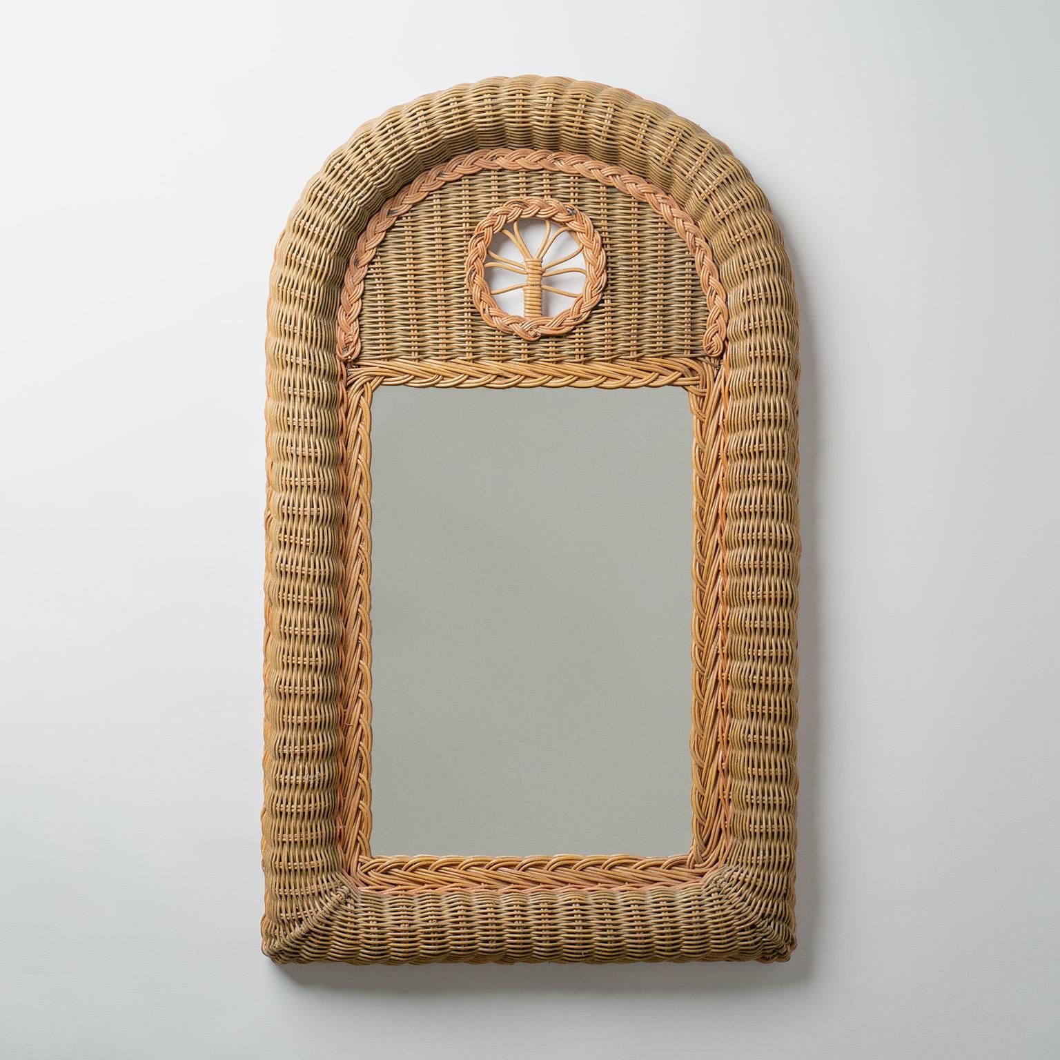 French artisanal rattan mirror from the 1970s. Nice Folk Art rendition of the classic French Trumeau mirror in subdued earthy tones with a charming floral detail.Very nice original condition with original mirror.
Measures: Height 78cm (30.5″), Width