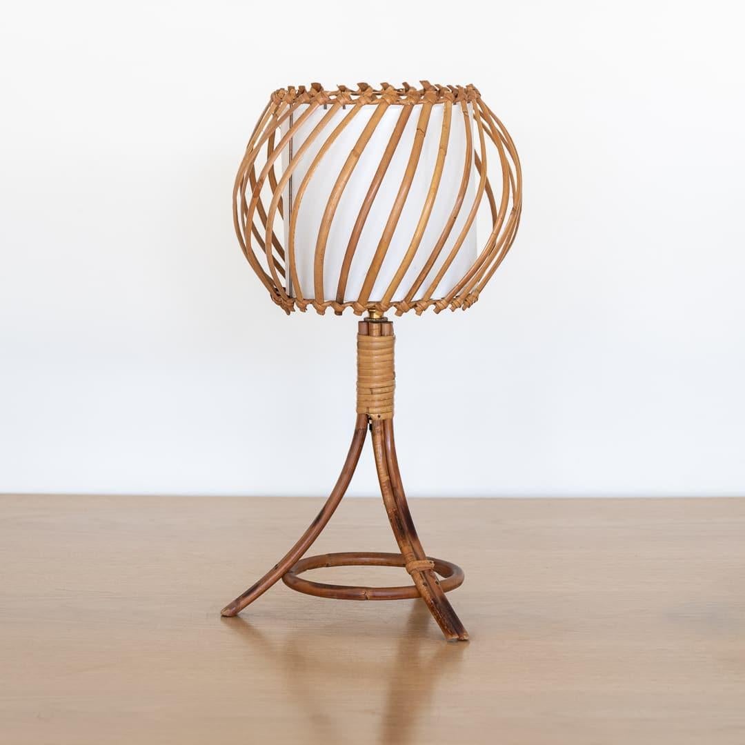 Unique vintage rattan table lamp in the style of Louis Sognot from France, 1960s. Rattan three leg base with large rattan orb shade and new interior silk diffuser. Newly re-wired. Takes one E12 base bulb, 25 W or higher using LED.



.