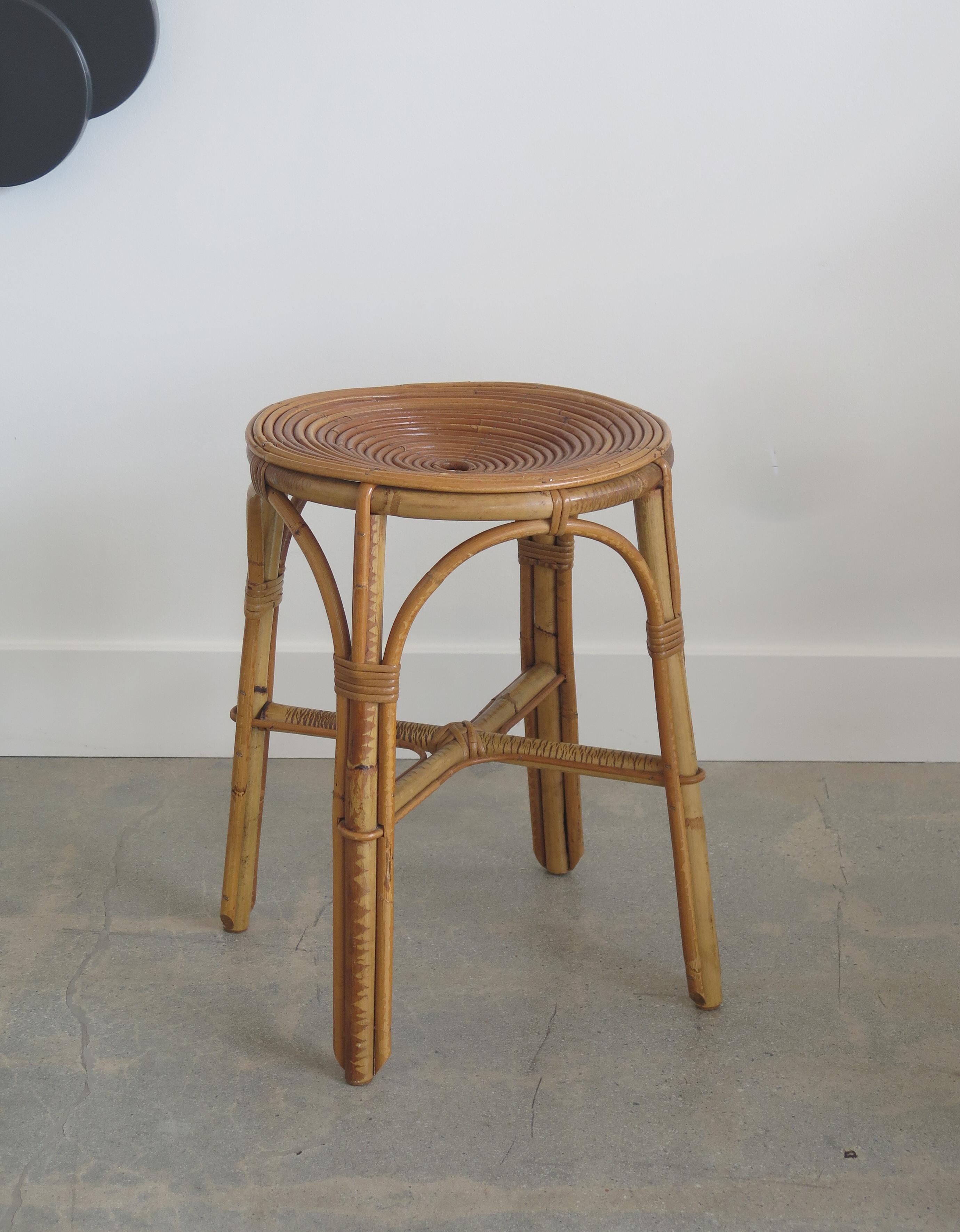 French rattan stool with circular spiraled rattan seat and rattan legs with wrapped rattan detail. Great condition in original finish.