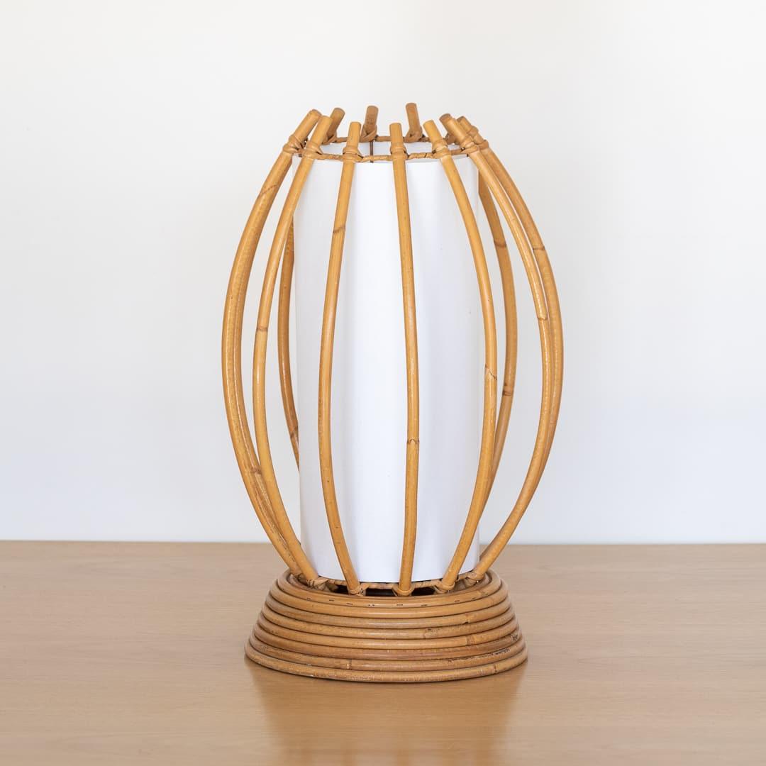 Fantastic large scale vintage French rattan table lamp in the style of Louis Sognot, France 1960's. Long orb-shaped shade with circular rattan base and new silk interior shade. Newly re-wired. Takes one E12 base bulb, 25 W or higher using LED.



 