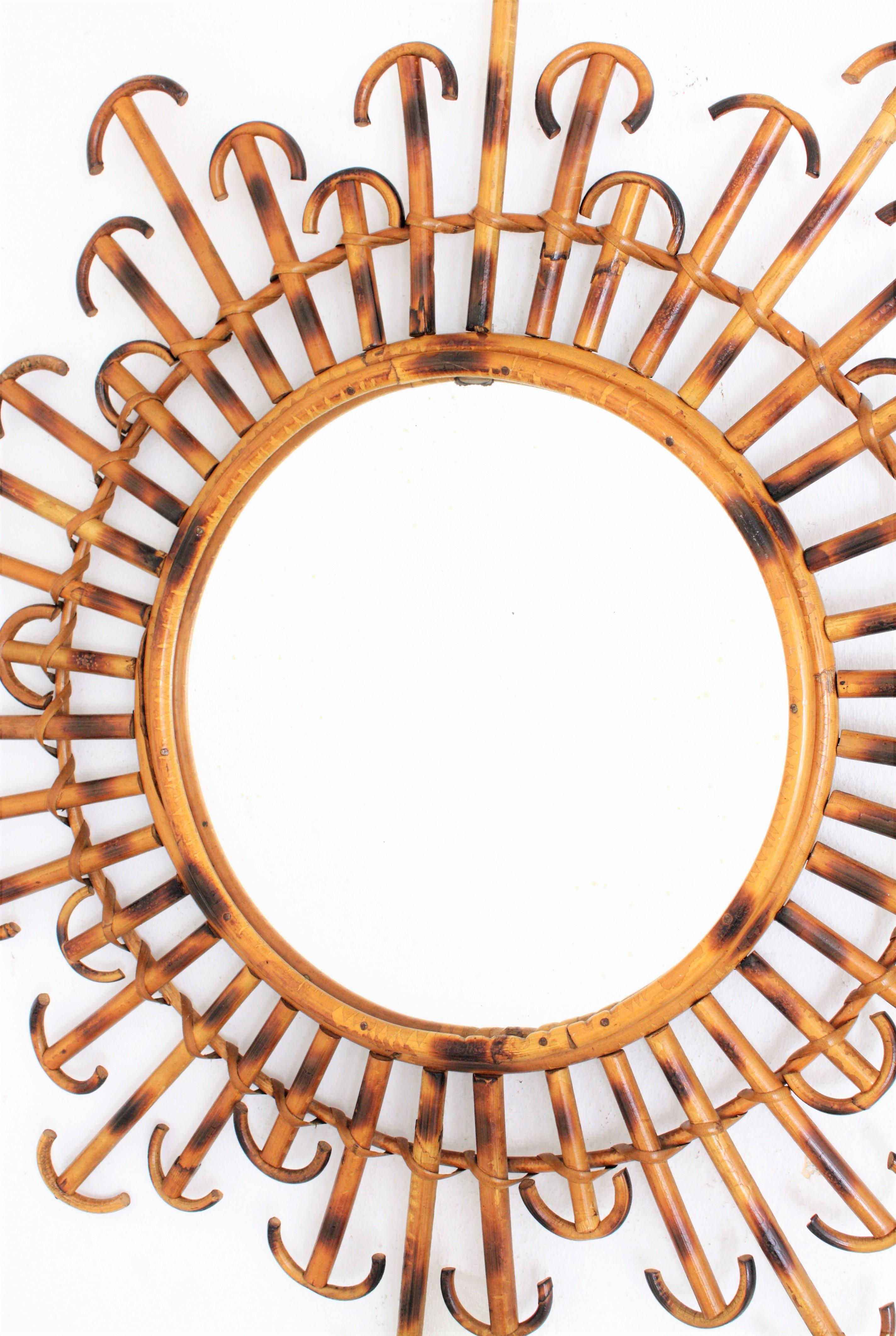 French Rattan Wicker Sunburst Mirror with Curved Endings, 1950s In Excellent Condition In Barcelona, ES