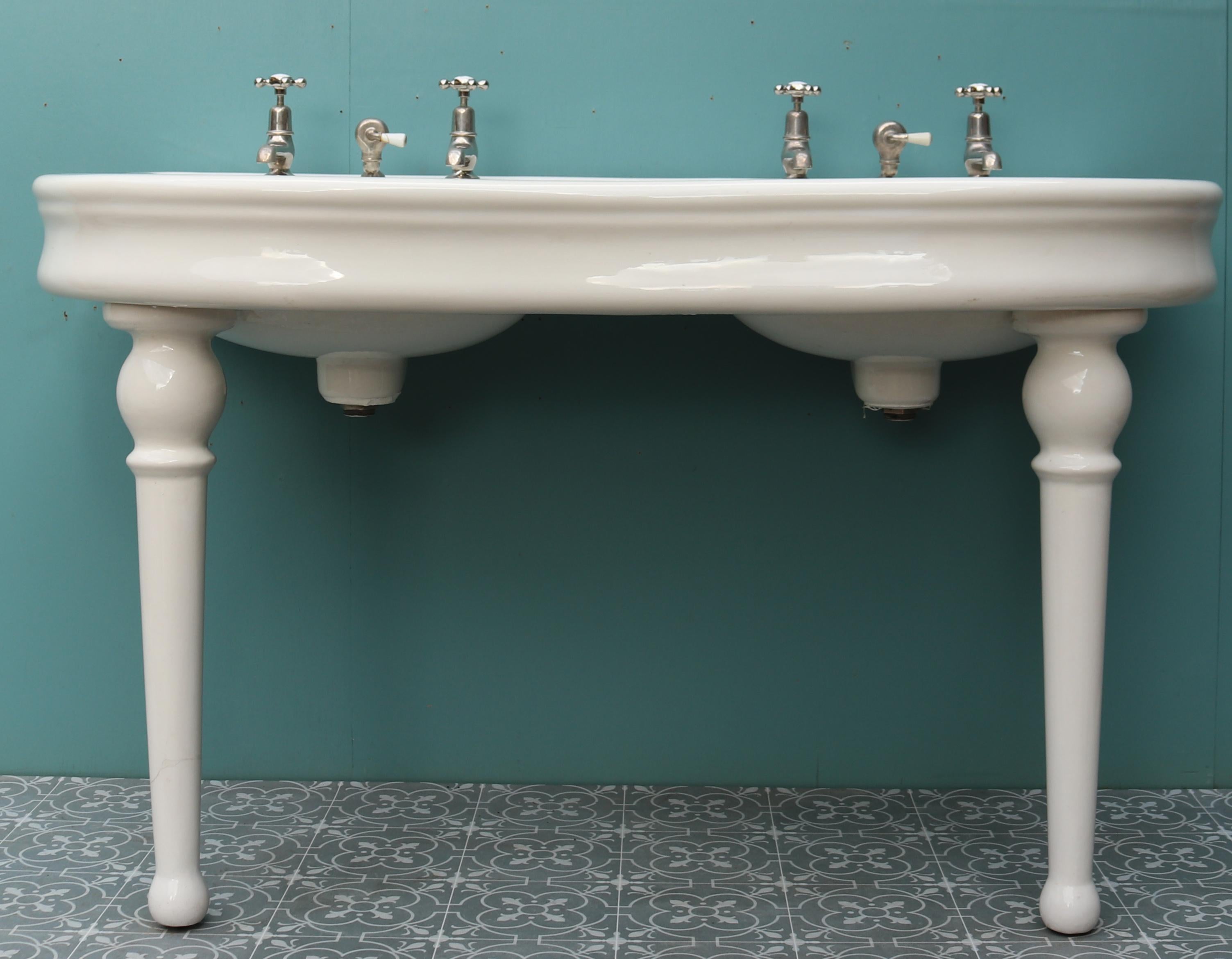 A reclaimed French double basin in the style of Jacob Delafon. Standing on porcelain legs and fitted with nickel plated taps and wastes.
 
Additional Dimensions:
 
85 cm Height to ceramic
 
Tap 13 cm height
 
Overall height 145 cm
 
Depth 70.5 cm