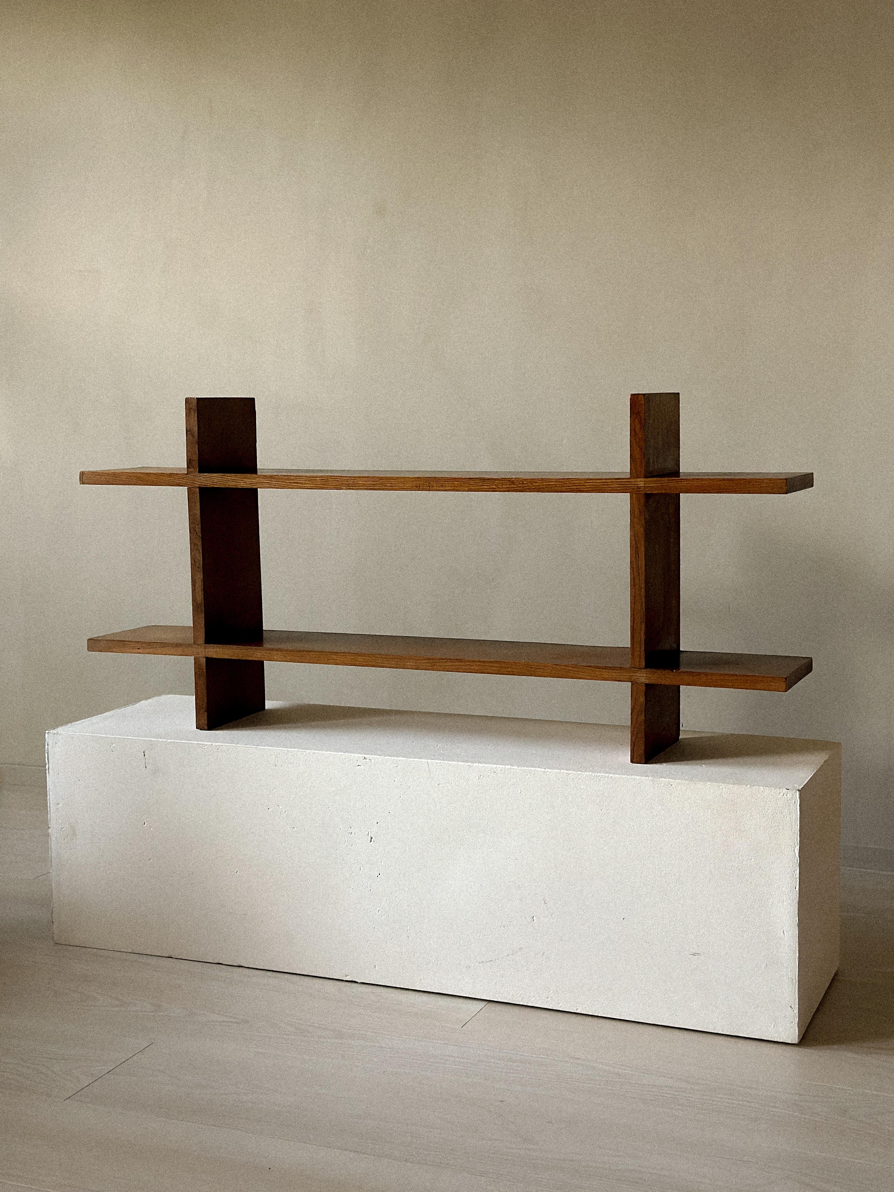 Oak wall shelf from France, c. 1950s. A piece from the French Reconstruction era, with clean lines and a warm, natural patina. Simple, functional design that reflects the understated character of the period. Wear consistent with age and use. Marks,