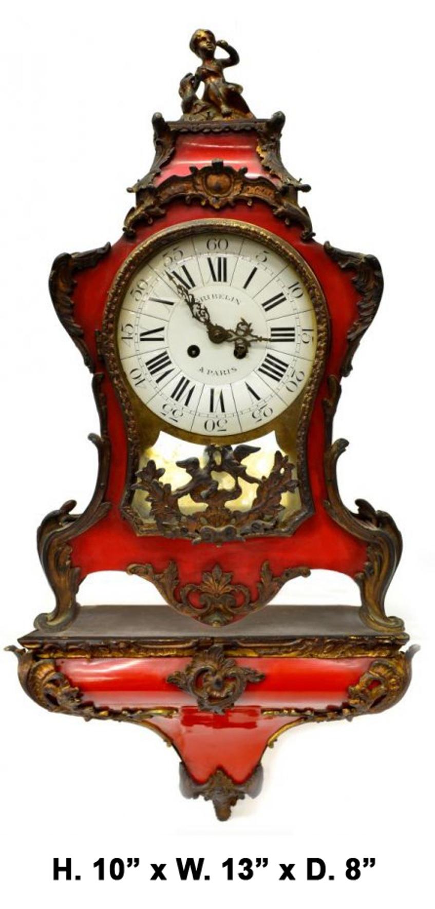 French 19c Louis XV style red mantle and wall clock on wall bracket signed GRIBELIN a Paris
The clock is surmounted with a gilt bronze seated girl dressed in traditional clothing above a enamel round face presenting with Roman numerals, above a
