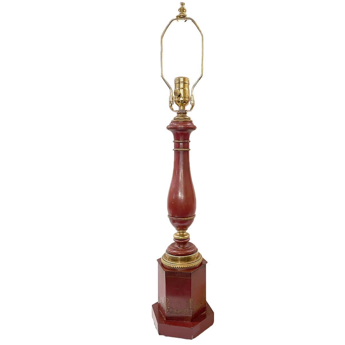 A circa 1920's French painted tole table lamp with gilt details.

Measurements:
Height of body: 18.5
