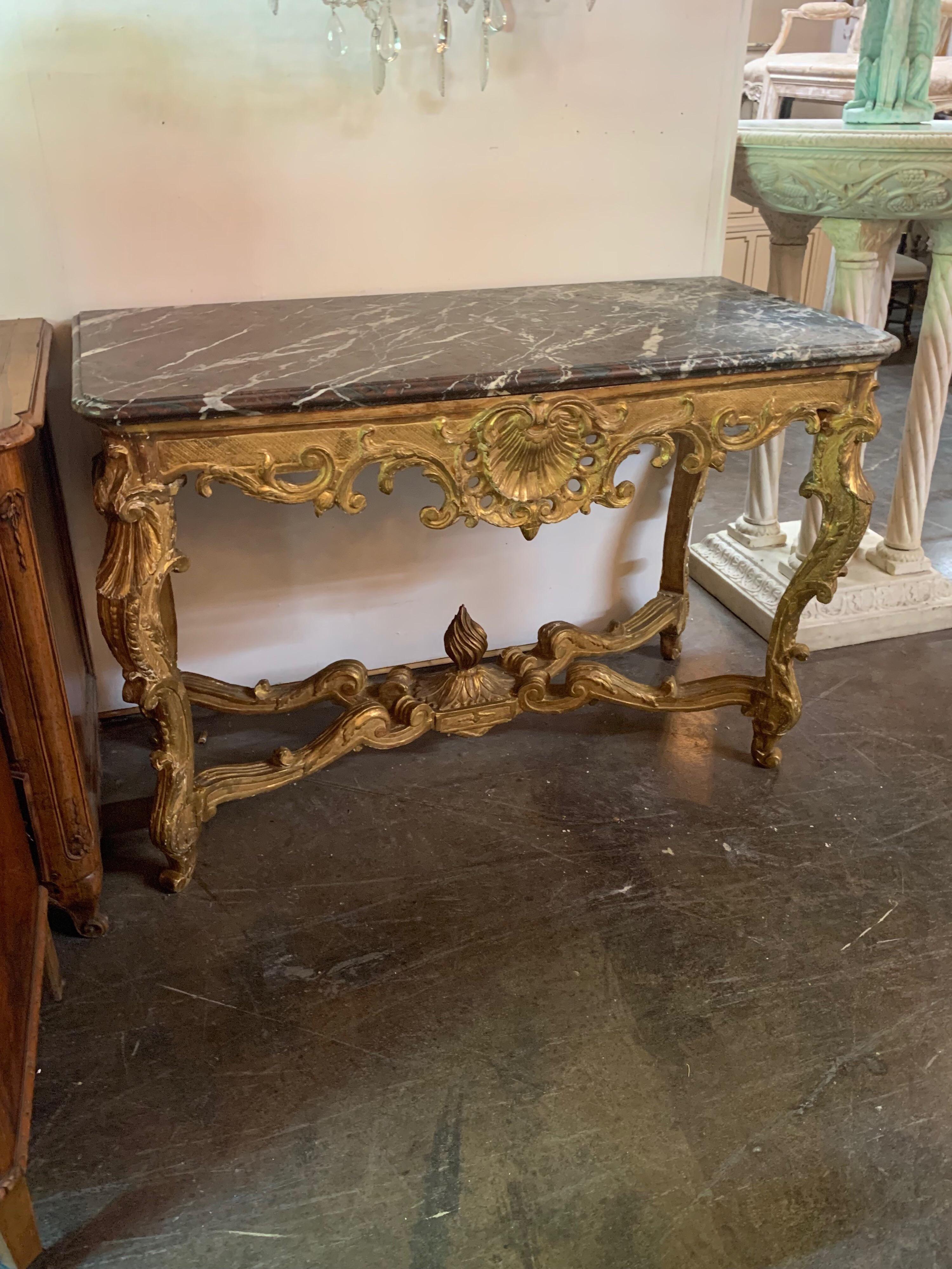 Period French Regence carved and giltwood console with original rouge and grey marble top. Very fine carving and gilt on this piece. Stunning,
circa 1720.

  