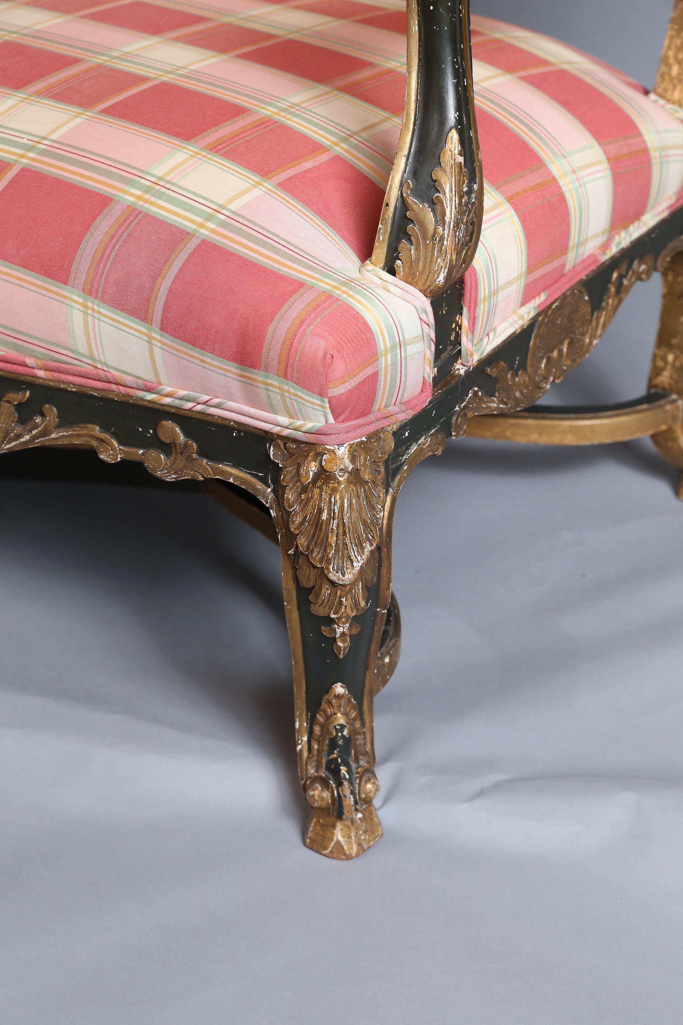 Wood  French Regence Period Black and Gilt  Carved Settee For Sale