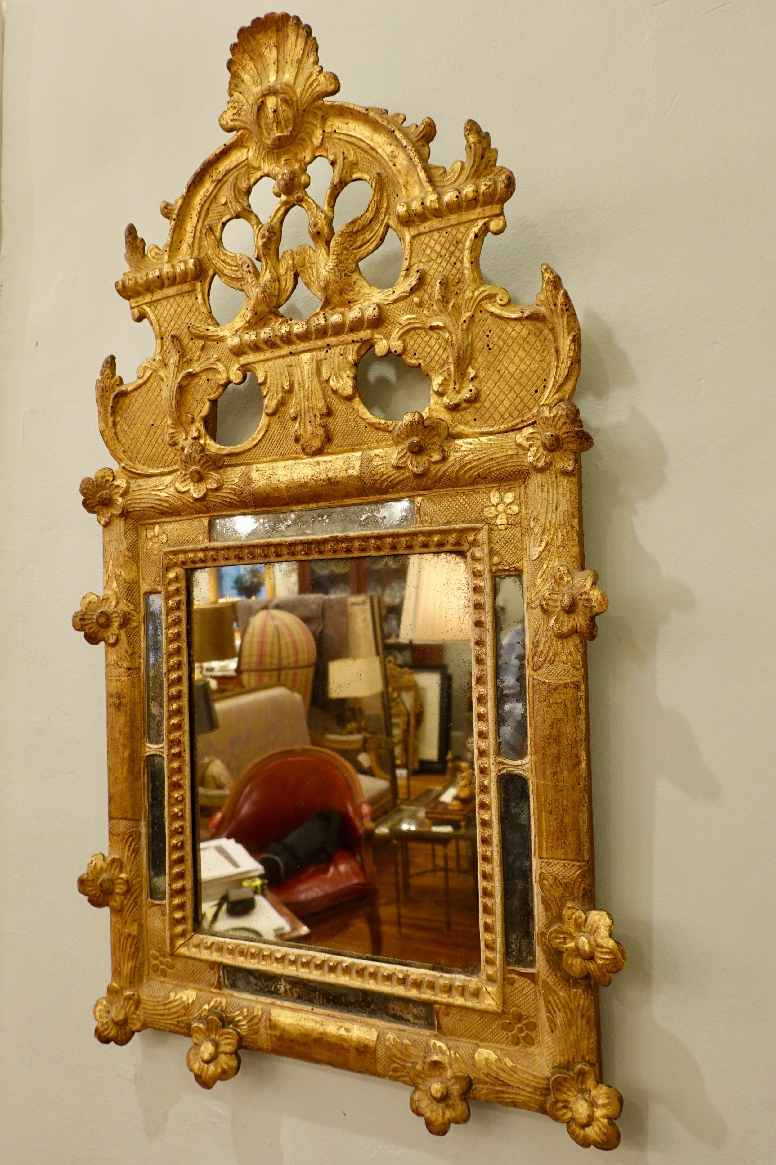 Régence French Regence Period Giltwood Mirror with Birds, Scallop Shell and Flowers For Sale