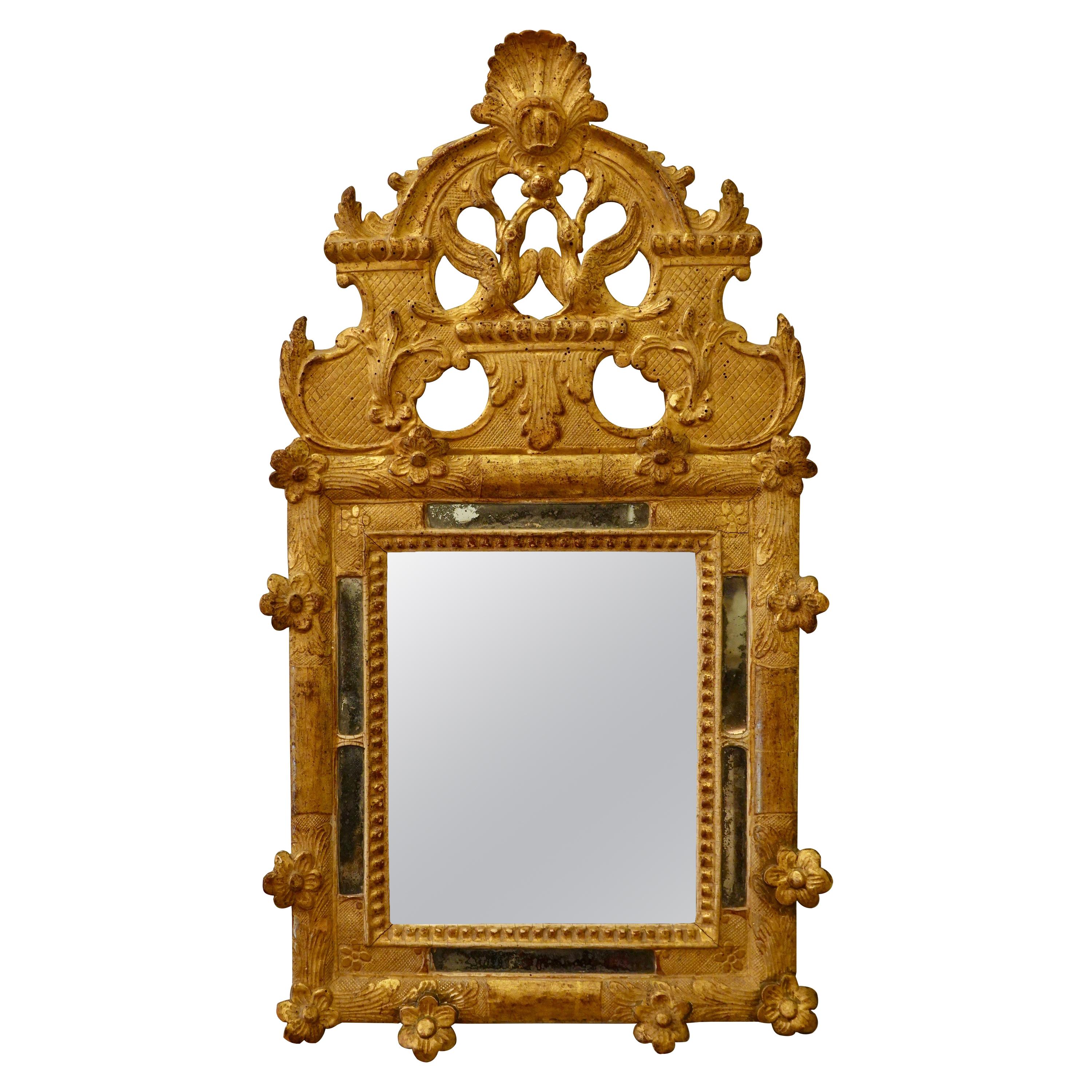French Regence Period Giltwood Mirror with Birds, Scallop Shell and Flowers For Sale