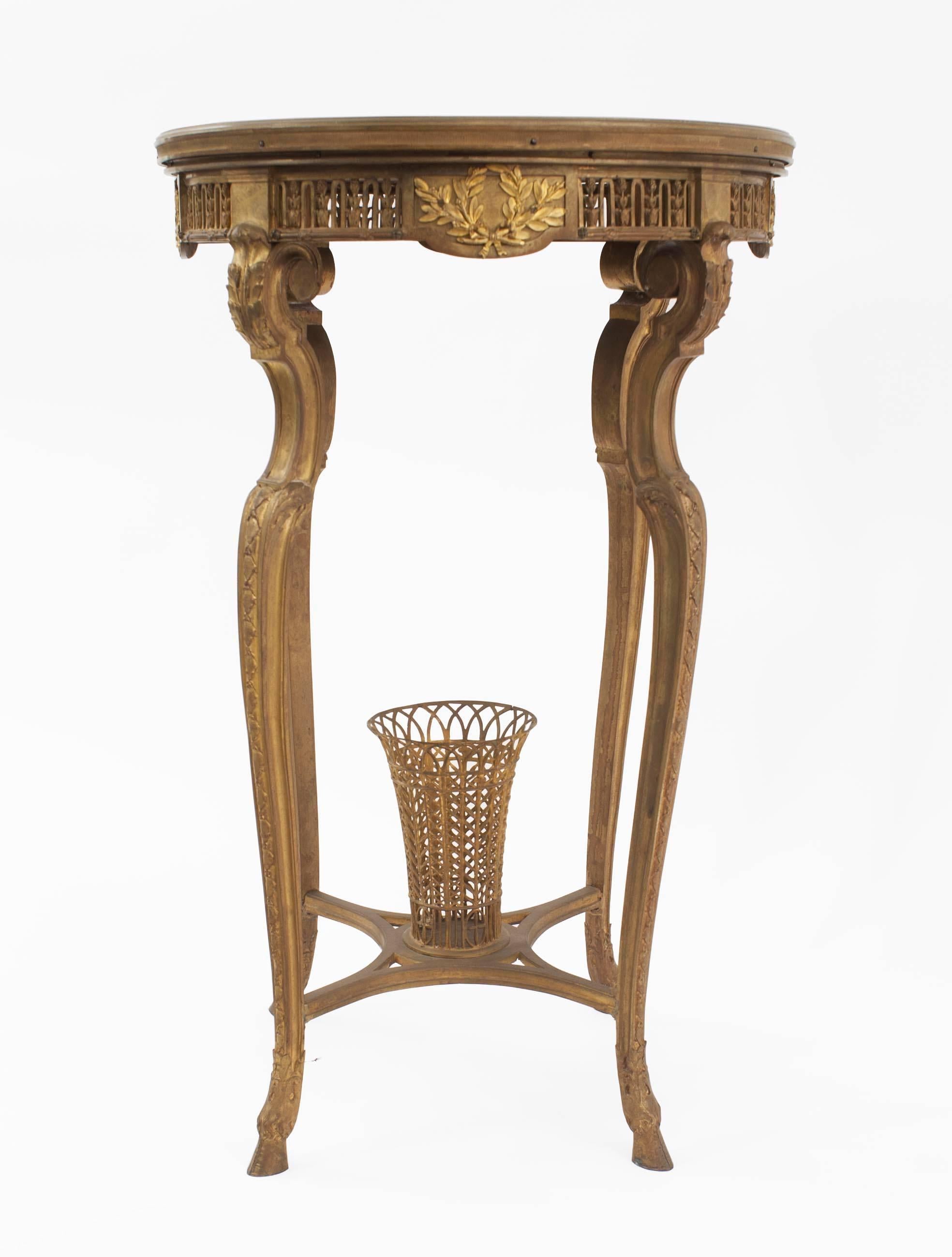 French R√©gence-style (19th Century) round bronze dore end table with basket stretcher and marble top.
