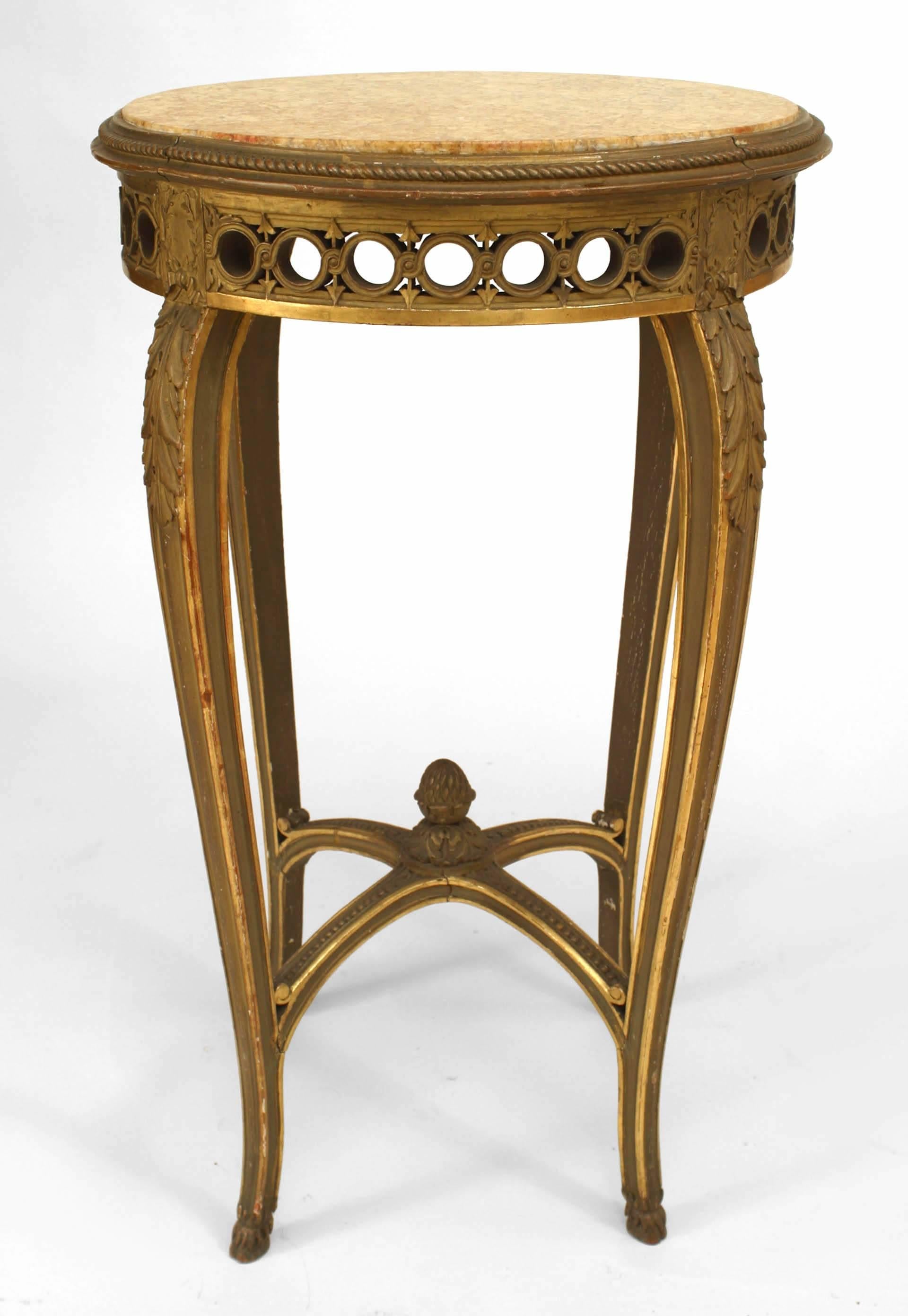 French Regence style ‘19th century’ round giltwood end table with circle filigree apron, finial stretcher, and yellow marble-top.
   