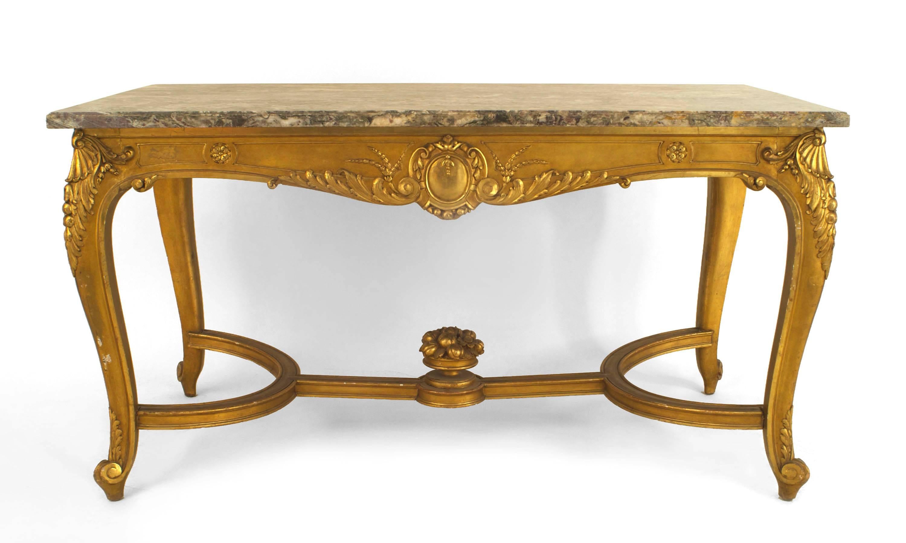 French Regence style (19th Century) gilt rectangular center table with carved stretcher and grey marble top.
