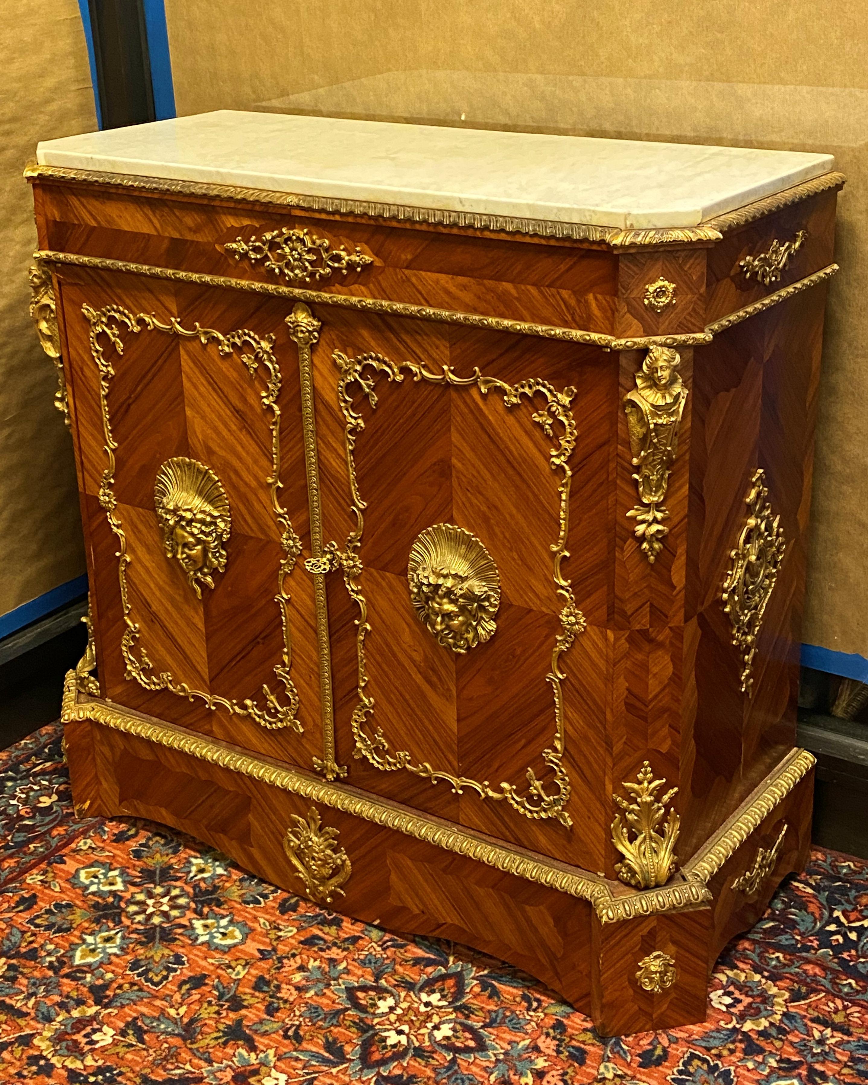 French Regence style bronze mounted marble top cabinet.