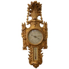 Baromètre en bois doré de style Régence