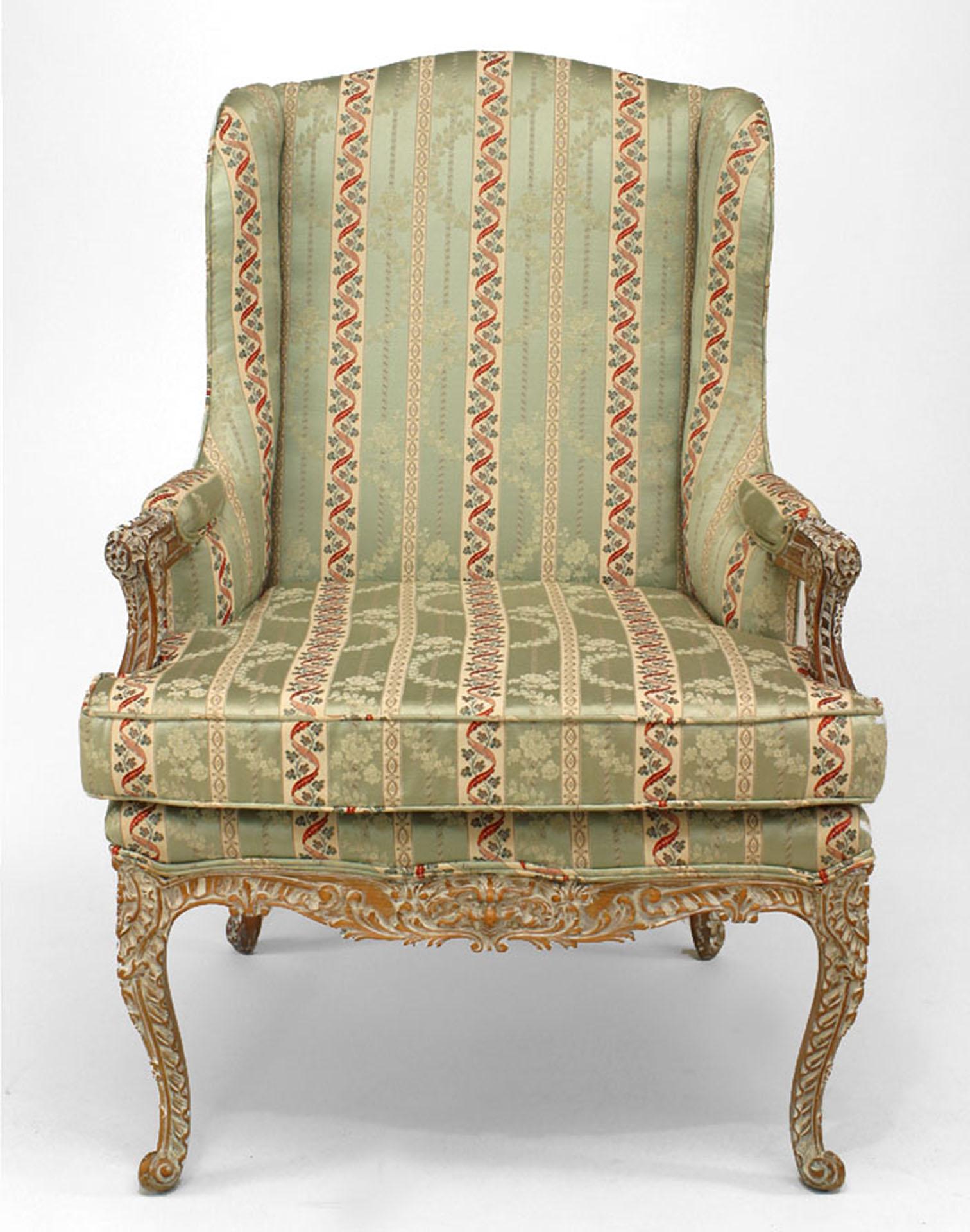French Regence-style (19th Century) bleached and carved open arm chair with green stripe upholstery
