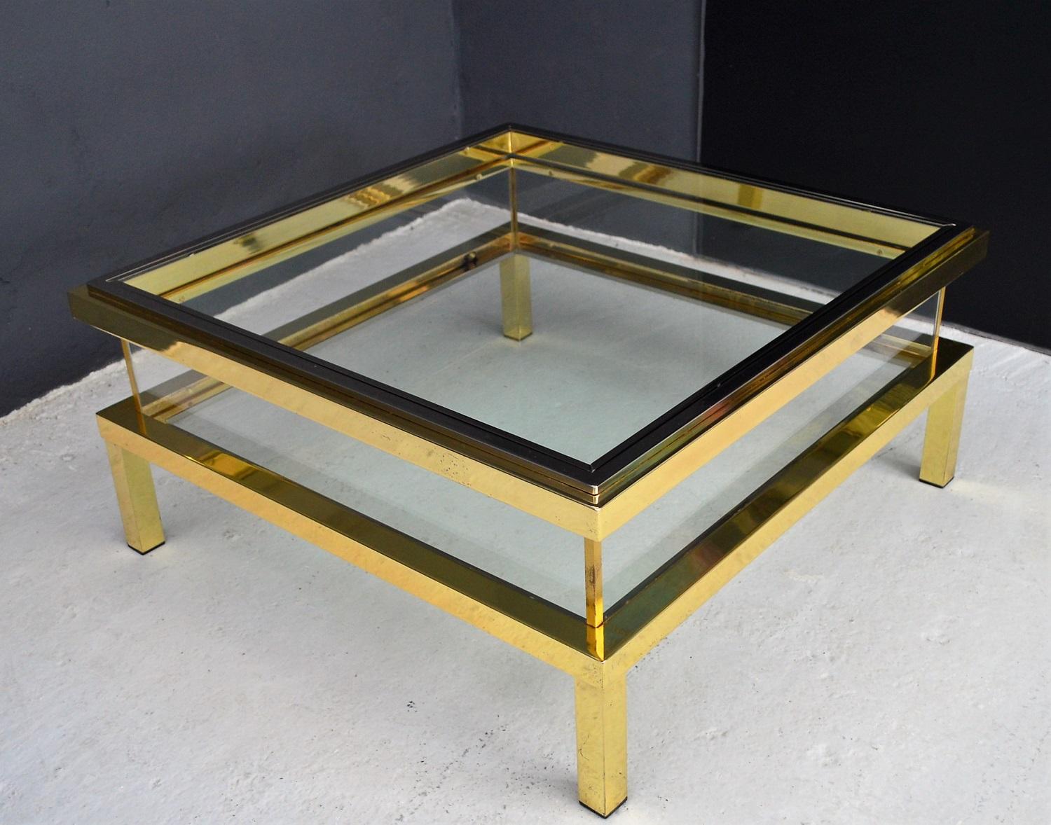 Beautiful coffee table made of shiny Brass with chrome details and glass slide-on showcase manufactured by Maison Jansen in the 1970s, France.
The table is very heavy, the used materials and craftsmanship excellent.
Very good vintage condition