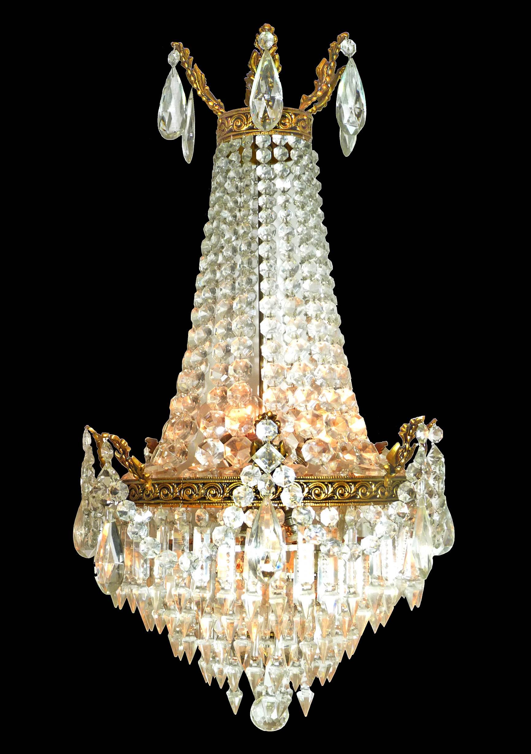 Six-light French empire chiselled gilt bronze chandelier with cut crystals plums and
Measures:
Diameter 16 in/ 40 cm
Height 52 in =30 in + 22 in/chain (130 cm= 75 cm + 55 cm/ chain) 
Weight 22 lb/ 10 Kg
Six-light bulbs E14, good working