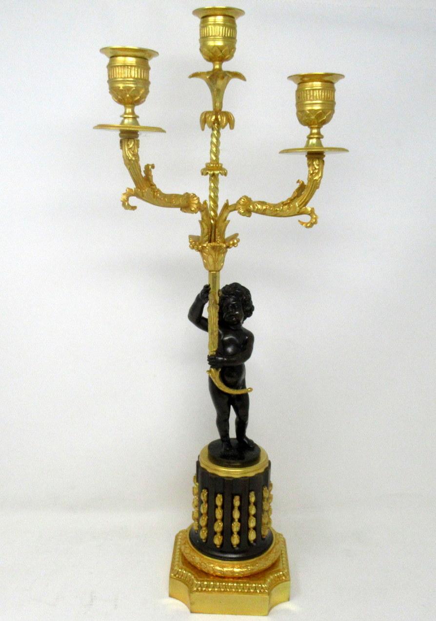 Stunning rare pair of French empire ormolu and patinated bronze three light candelabra. First quarter of the 19th century, possibly Regency period.

Attributed to Pierre-Philippe Thomire after a Design by Charles Percier, French Architect of the