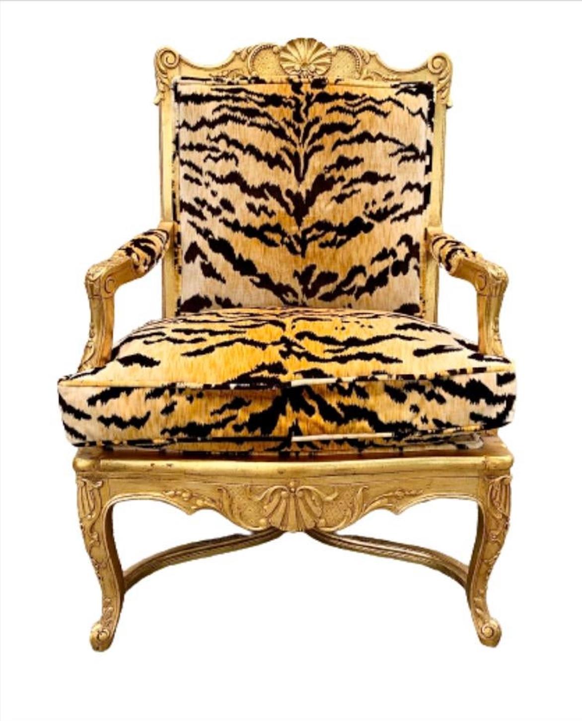 A stunning French Regency style armchair

Early 20th Century

Hand carved gilt wood frame, with down filled cushion, and tiger patterned silk velvet upholstery.

Measures: 29