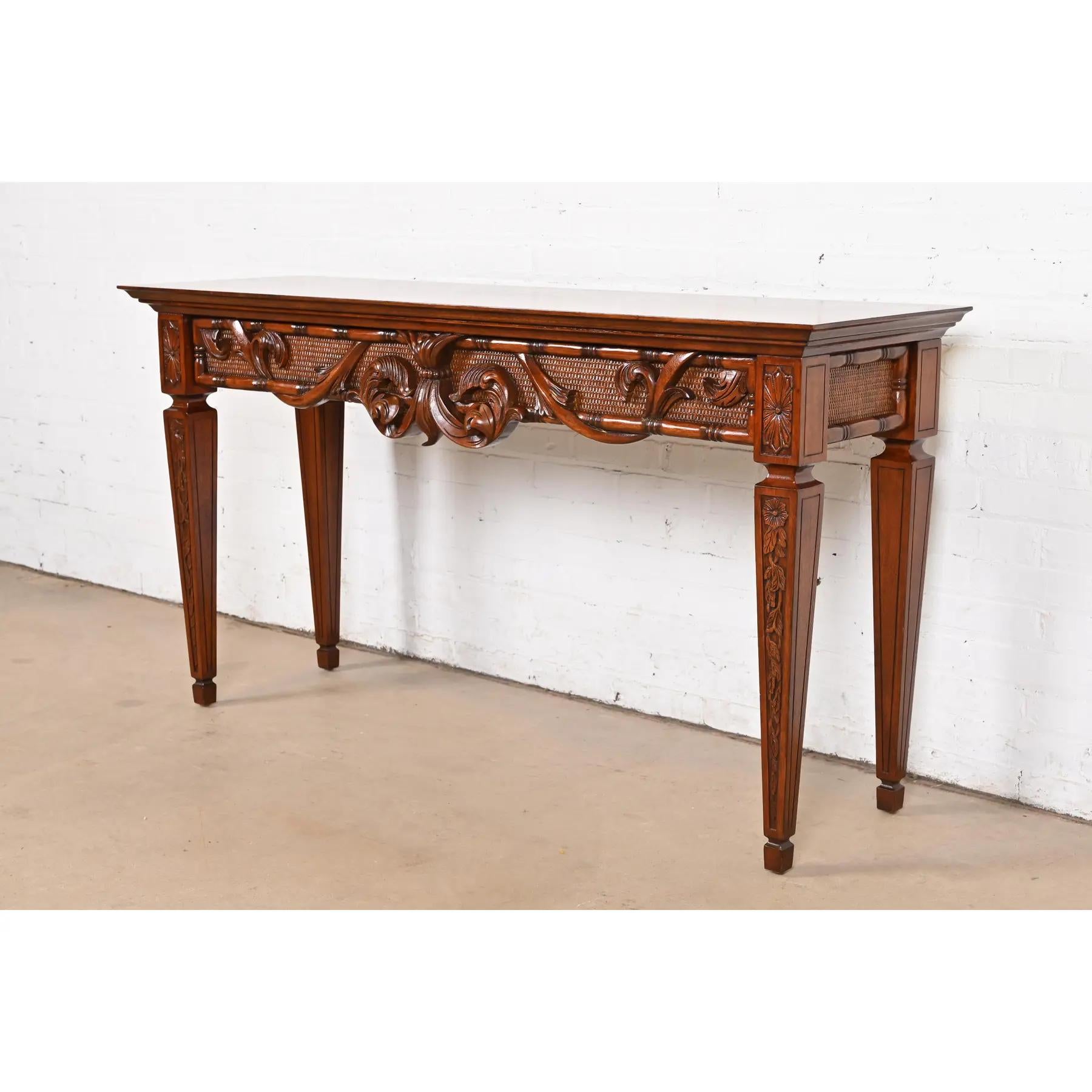 A gorgeous French Regency Louis XVI style console table, sofa table, or buffet server

USA, Circa Late 20th Century

Beautiful solid mahogany, with ornate carvings.

Measures: 59.5