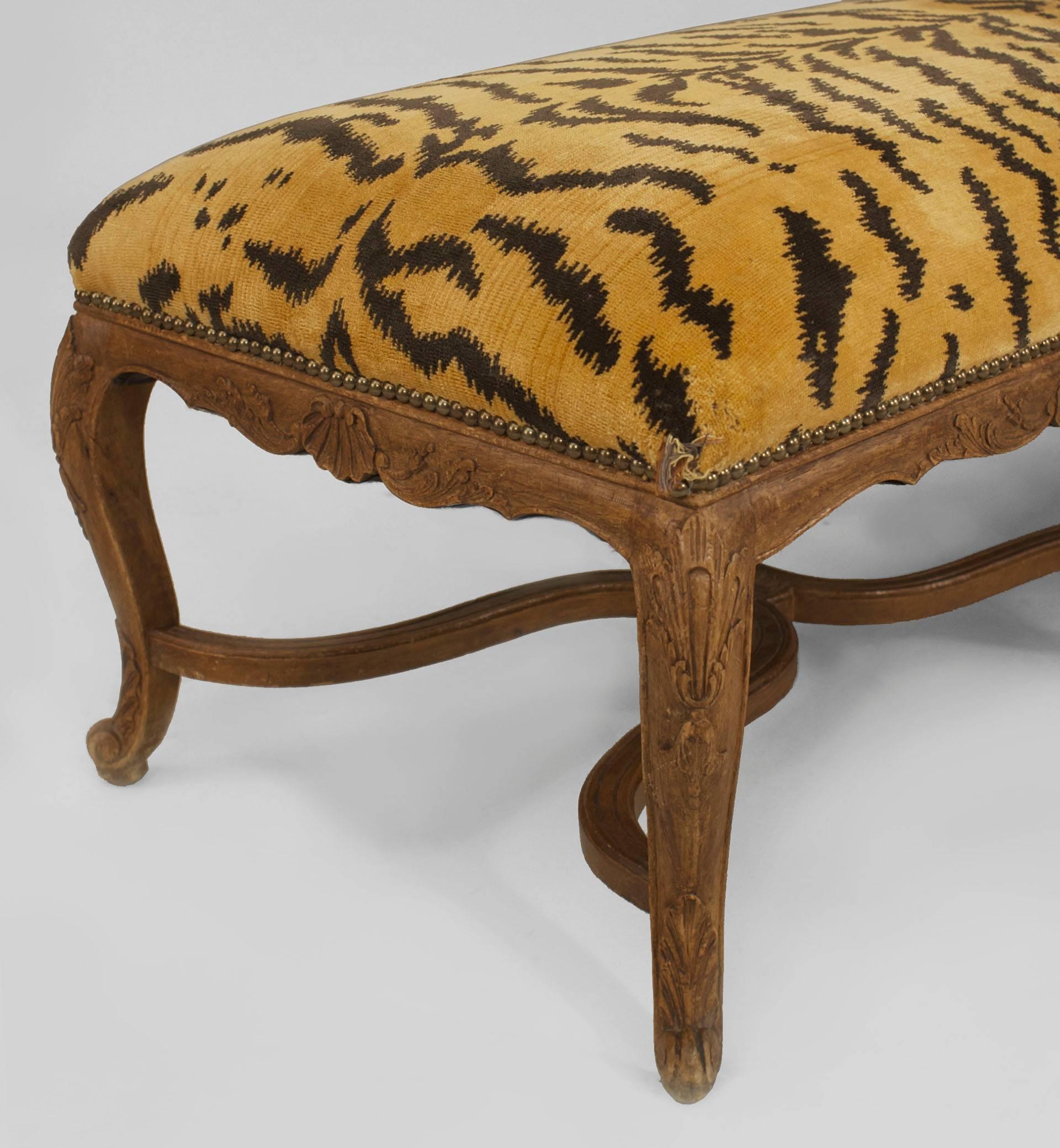 French Regence style (19/20th Century) walnut long 8 leg bench with a stretcher and a faux tiger upholstered seat
