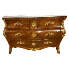 French Regency style bombe commode with white marble, ormolu mounted