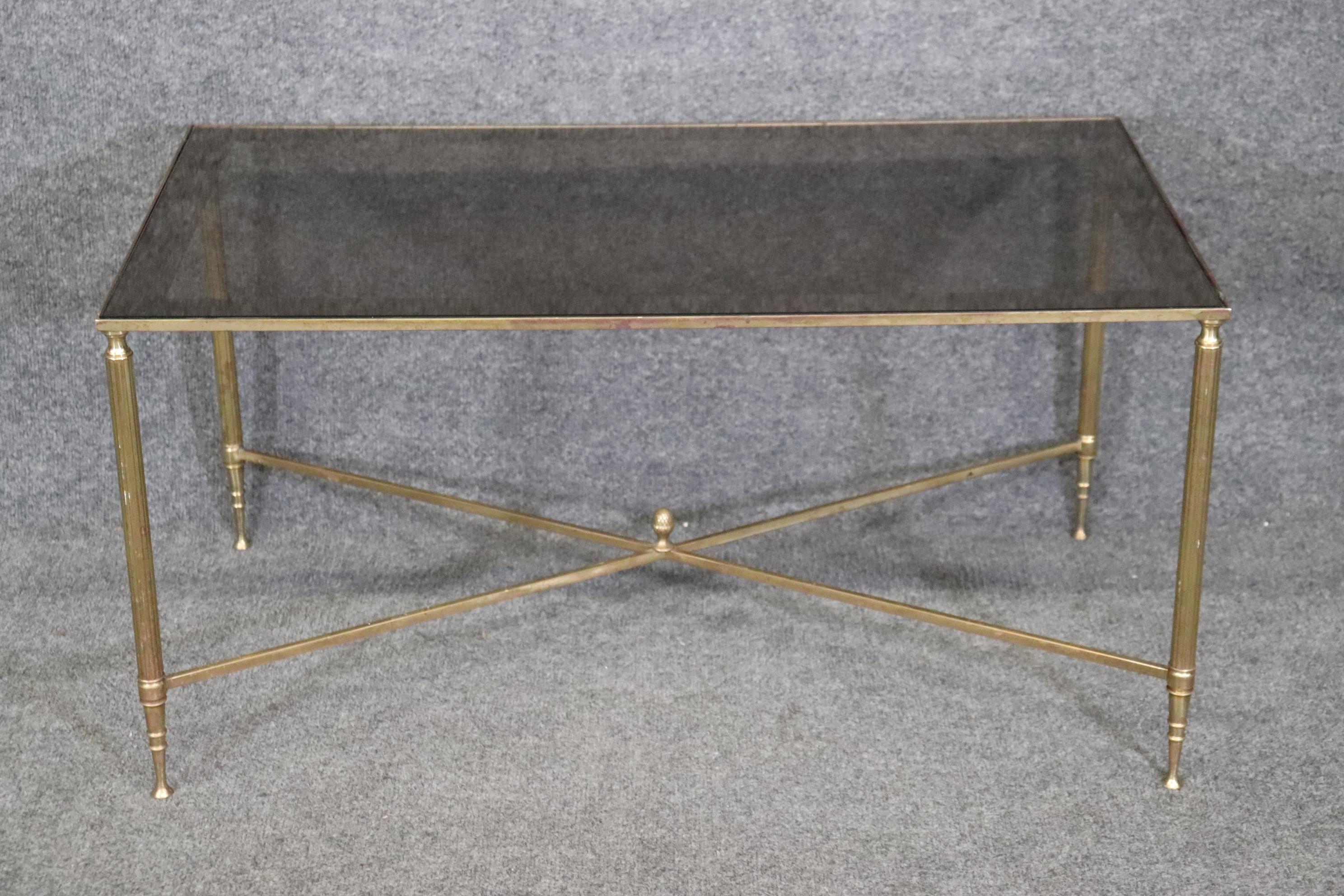 Dimensions: Height: 17 in Width: 33 3/4 in Depth: 19 in 


This French Regency style glass top coffee table is of the highest quality!  Although not signed, we strongly believe this was made by Maison Jansen. 
Maison Jansen made some of the world's