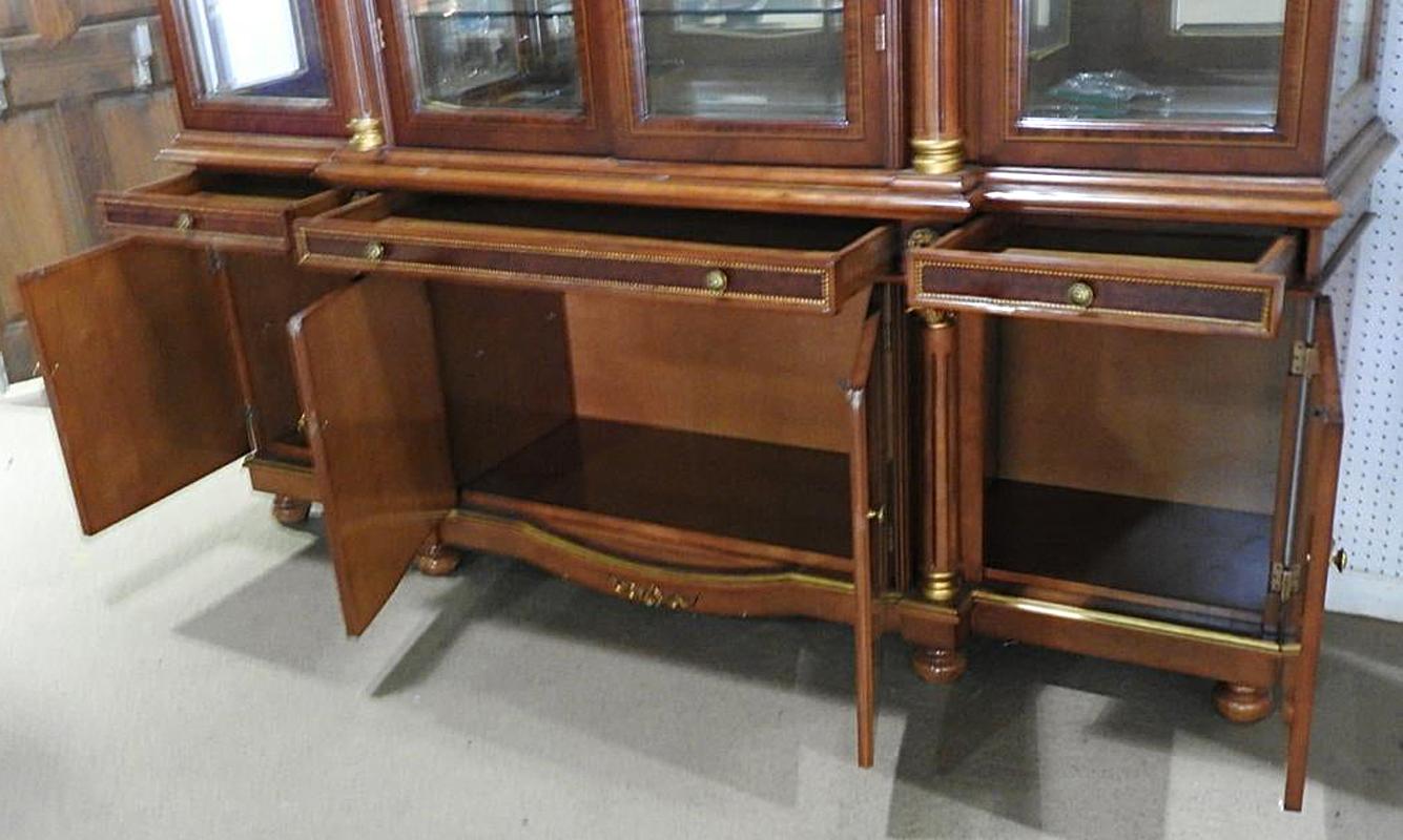French Regency Style Flame Mahogany Breakfront China Cabinet Vitrine by Safavieh In Good Condition In Swedesboro, NJ