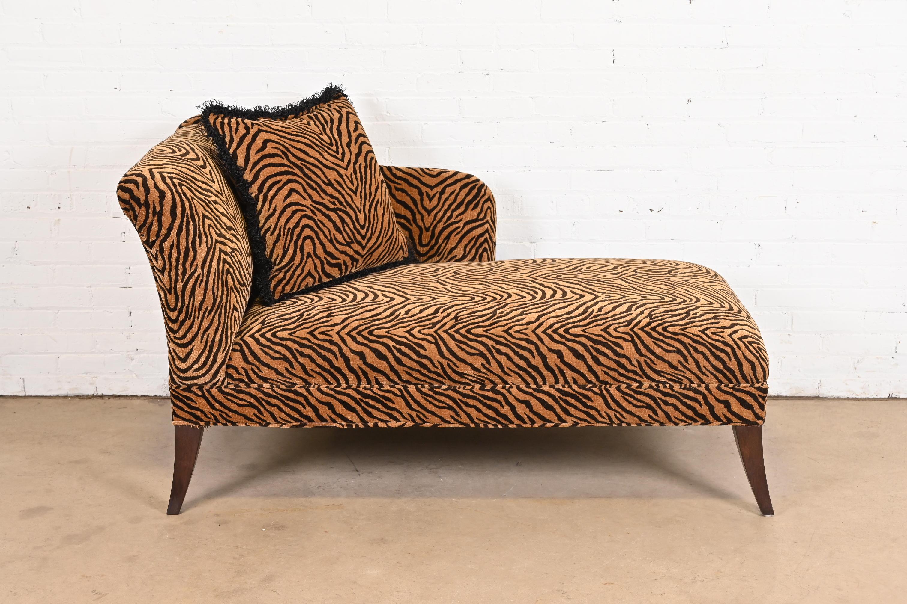A gorgeous French Regency style chaise lounge

USA, Circa Late 20th Century

Tiger print upholstery, with mahogany legs.

Measures: 62