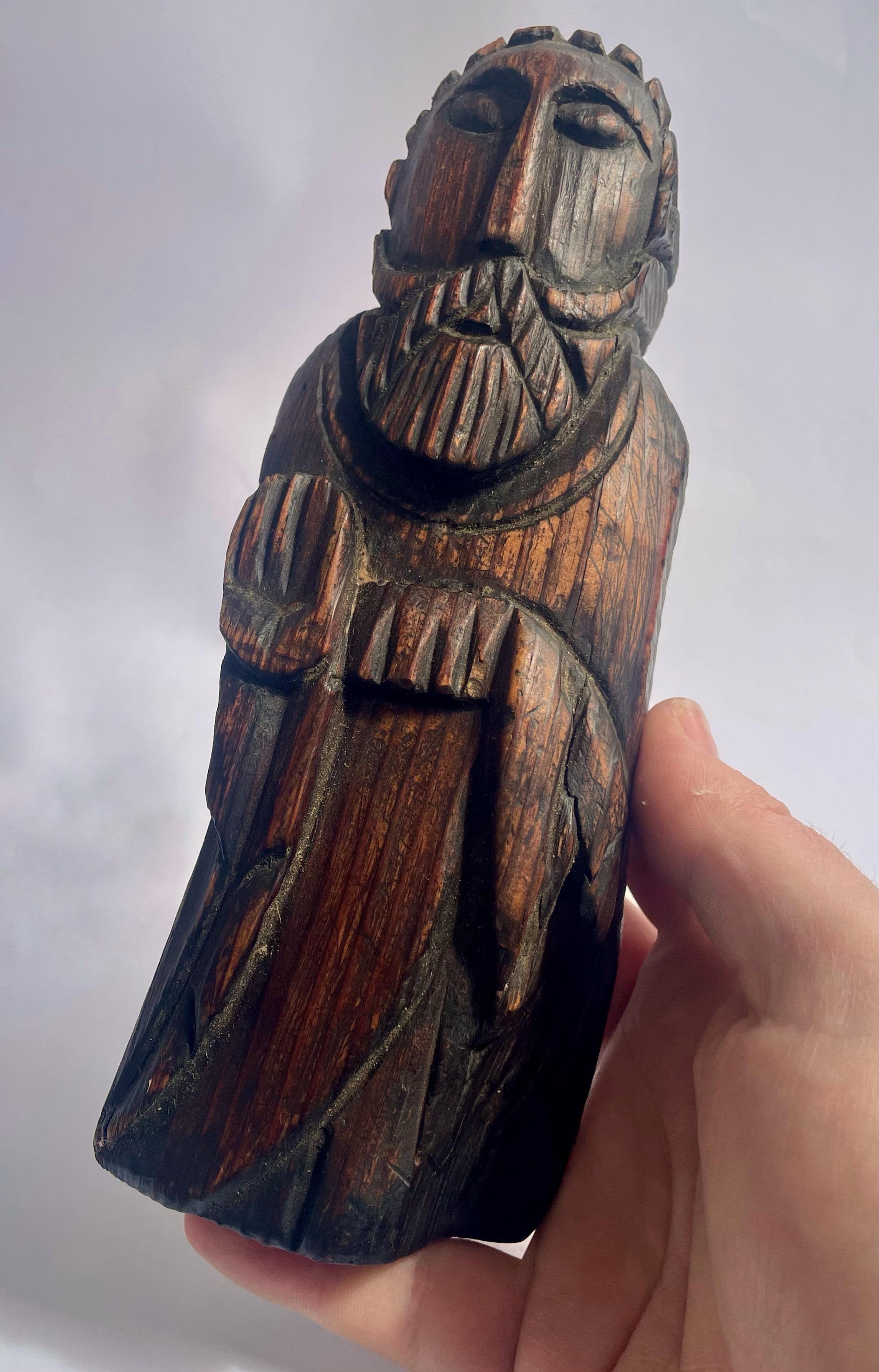 Saint Statuette – Mid-20th Century

Charming religious statuette carved in fir wood, dating from the mid-20th century. Dark stain highlights the natural grain of the wood as well as the details of the bearded face and garment. The naïve and