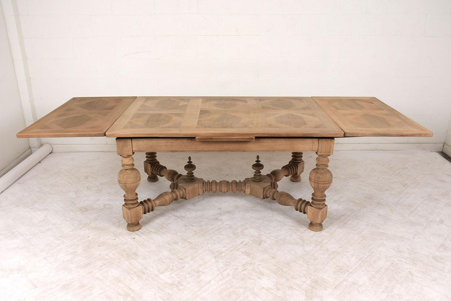 This 1890’s French Renaissance Dining Table is made out of walnut wood, has been professionally restored, and features a new bleached finish. The tabletop comes with marquetry designs and two extendable leaves underneath that pull out with ease and