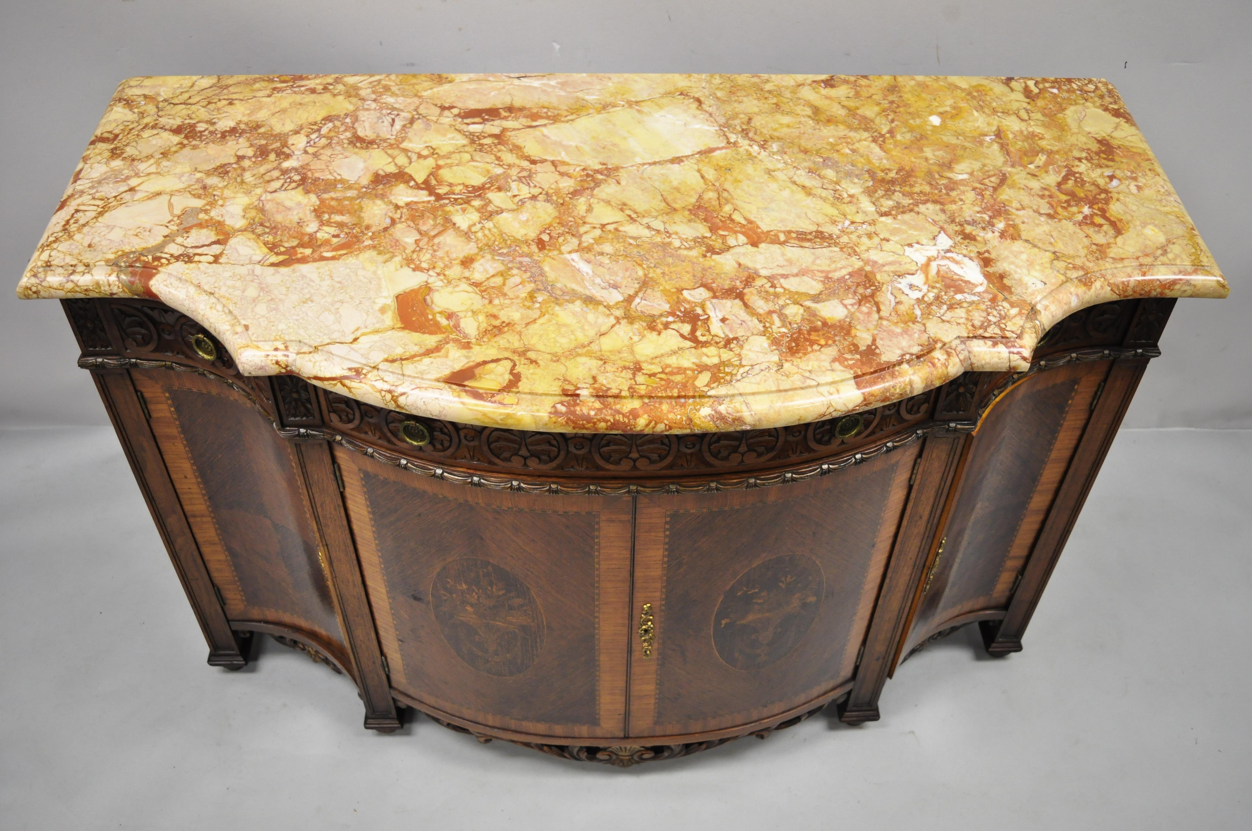 Antique French Renaissance Louis XV style marble top marquetry inlay serpentine buffet sideboard cabinet. Item features shaped rouge marble top, marquetry and floral inlay, serpentine front, nicely carved details, 2 swing doors, 6 dovetailed