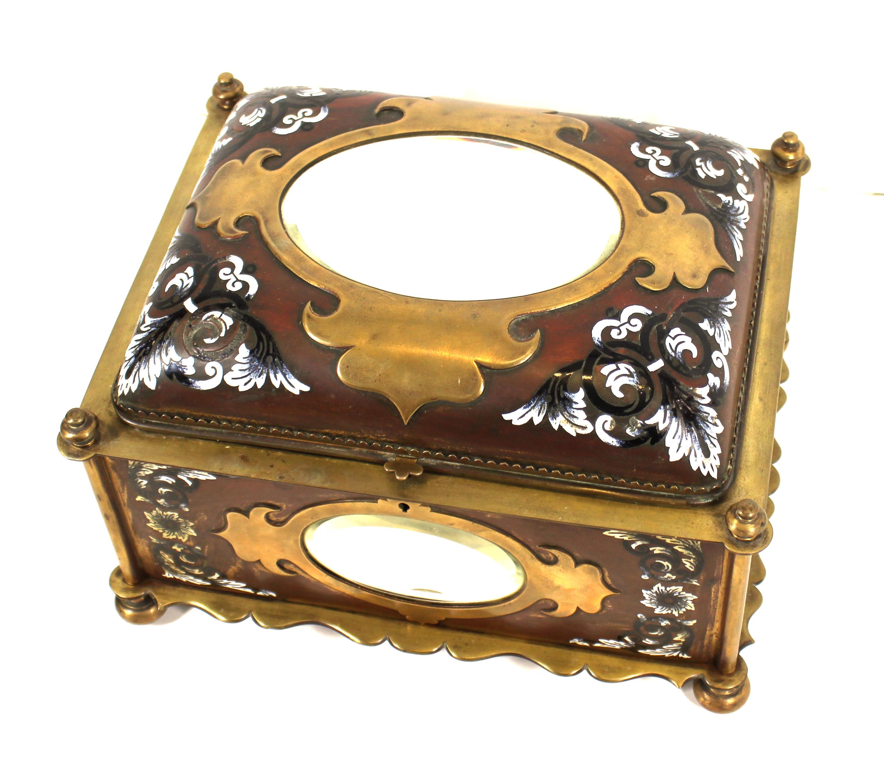 French Renaissance Revival champleve enamel jewelry box with oval beveled mirror inserts. Handmade in France during the mid-19th century. The piece has velvet interior lining and decorative floral enamel elements. In great antique condition with