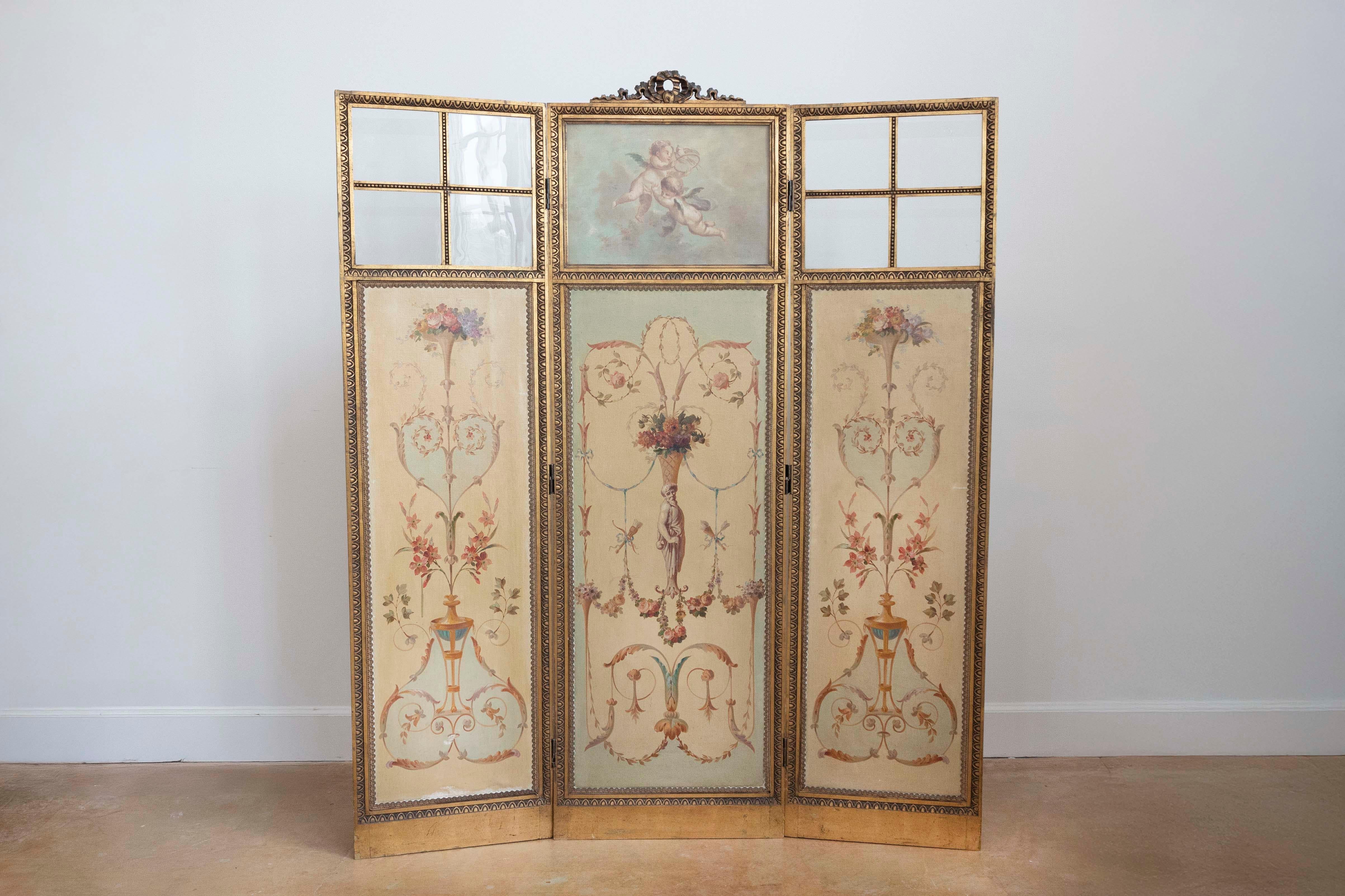A French Renaissance Revival folding three-panel screen with hand-painted Grotesque motifs and inset glass from the 19th century. Reminding us of motifs that one would see on the ceiling of the Uffizi gallery in Florence, this French painted screen