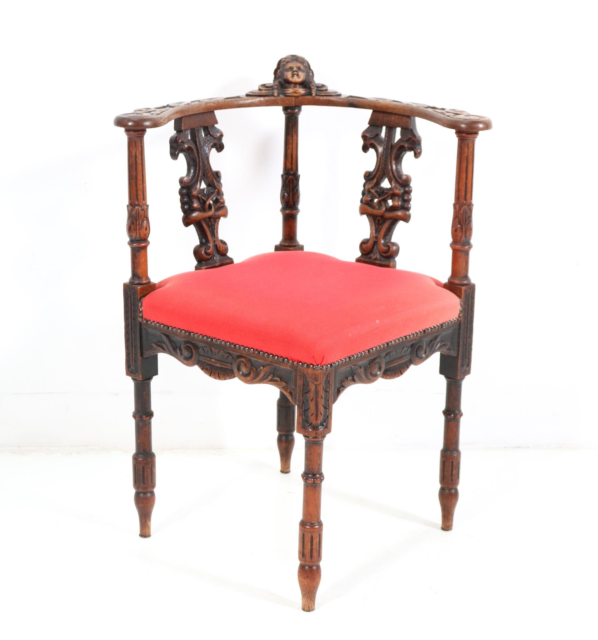 French Renaissance Revival Oak Carved Corner Armchair, 1890s In Good Condition For Sale In Amsterdam, NL