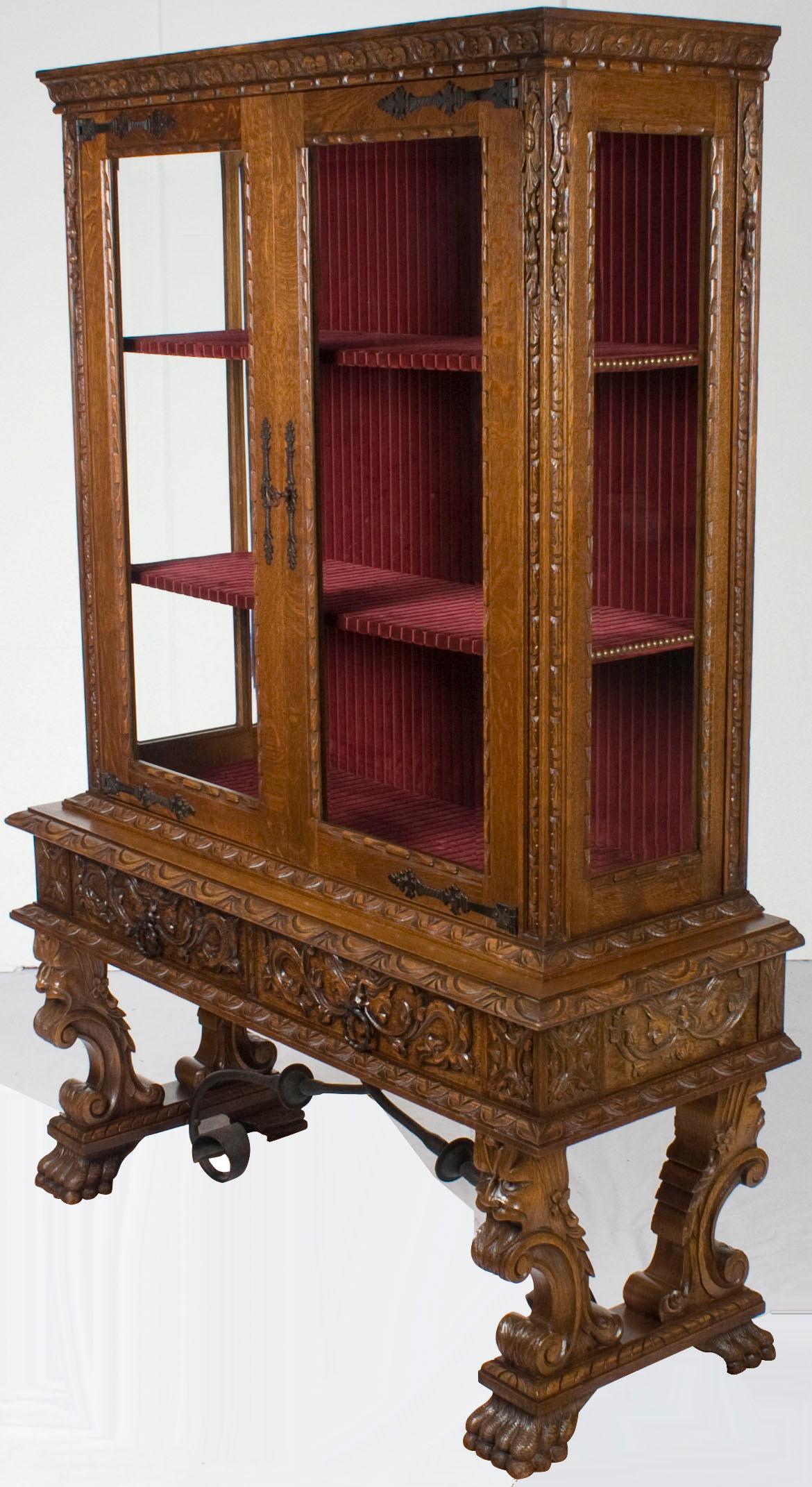 Typical of the style, this antique French Renaissance bookcase is decorated in elaborate hand carvings. The wood used is beautiful oak and that oak has developed a wonderful patina over the years.

The carvings are the most unique and wonderful