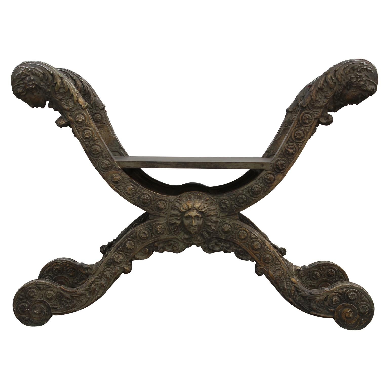 Stunning French renaissance style curule stool or bench made from intricately carved resin and wood.