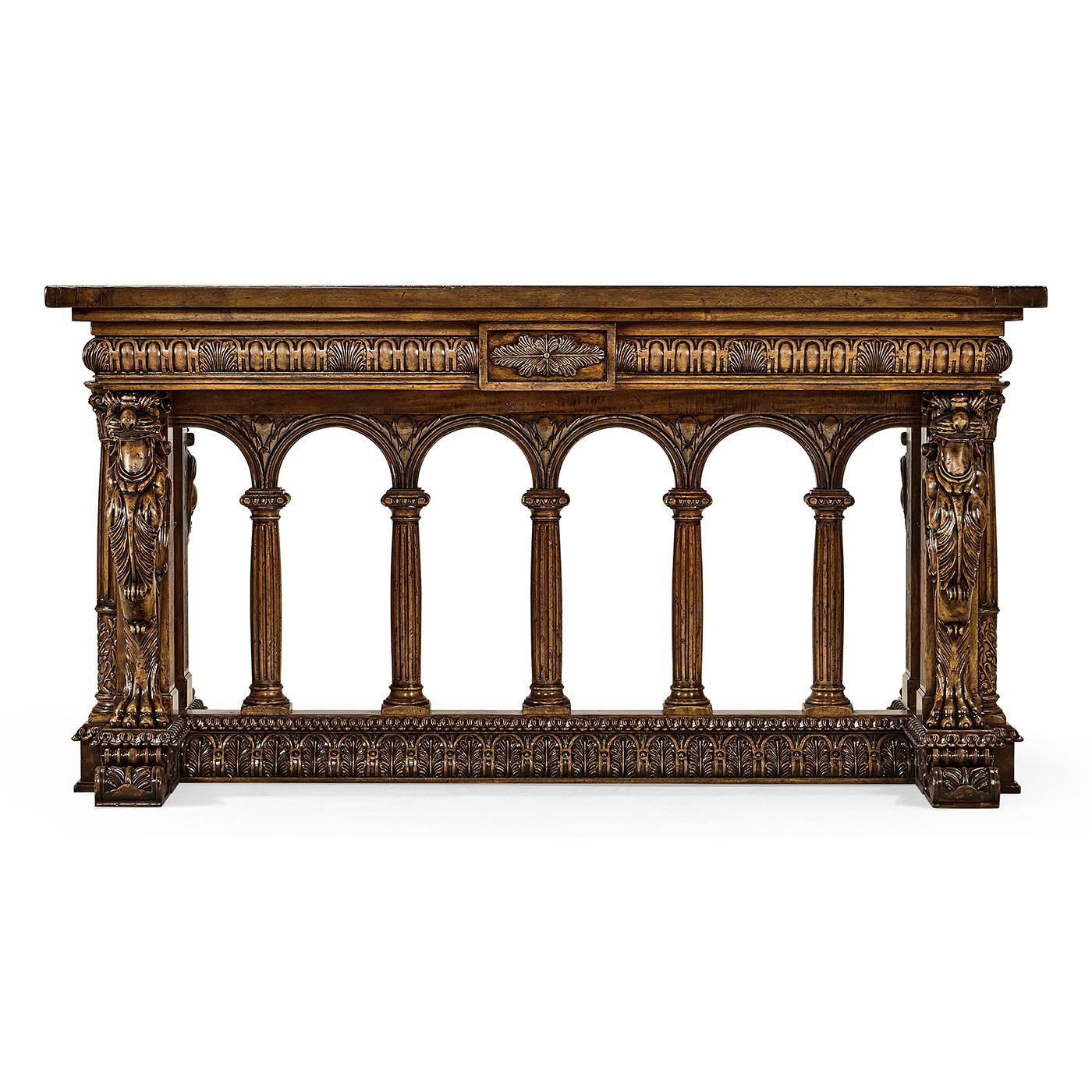 A fine French Renaissance walnut carved library table. This elaborately carved table is a wonderful homage to the early European craftsman. 

The Fine table is decorated with carvings of egg and dart moldings, winged Griffons, leaf-wrapped, and