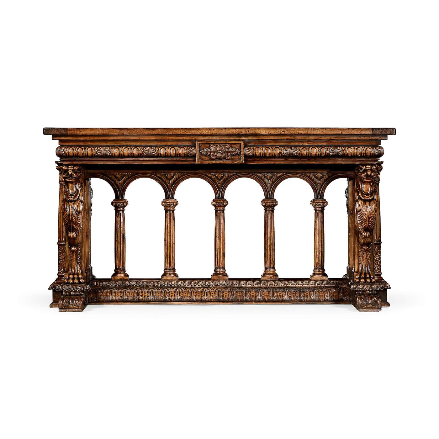 A fine French Renaissance walnut carved library table. This elaborately carved table is a wonderful homage to the early European craftsman. 

The Fine table is decorated with carvings of egg and dart moldings, winged Griffons, leaf-wrapped, and