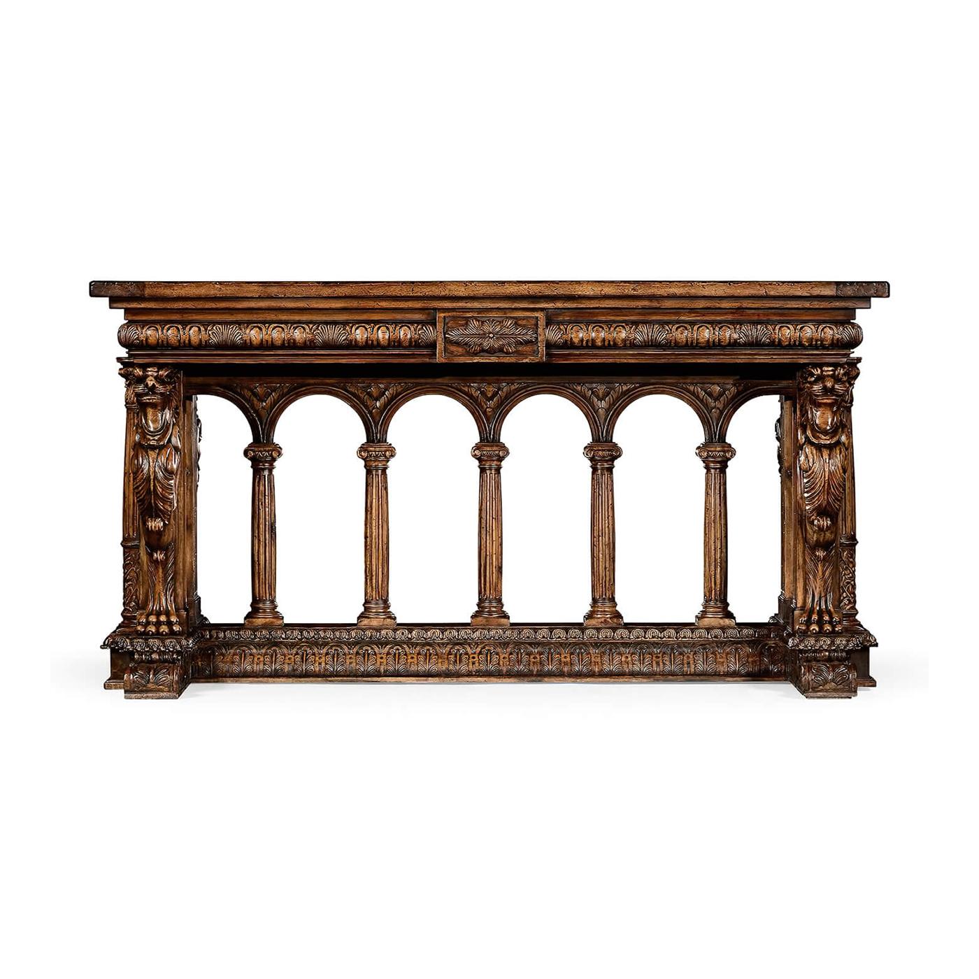 A fine French Renaissance walnut carved library table. This elaborately carved table is a wonderful homage to the early European craftsman. 

The Fine table is decorated with carvings of egg and dart moldings, winged Griffons, leaf-wrapped, and