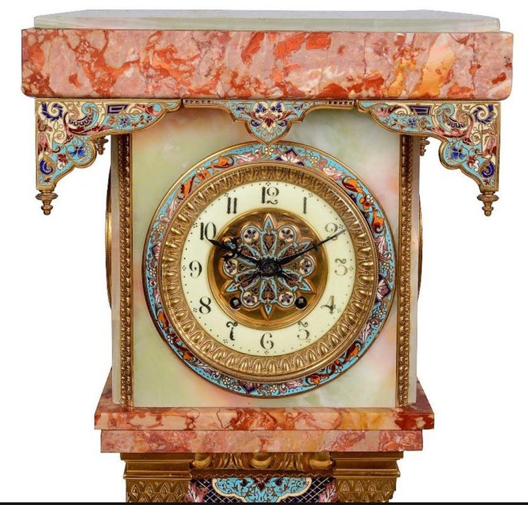 A fine quality, late 19th century, French Renaissance style Rouge marble, Onyx, gilded ormolu and champleve enamel pedestal long case clock. The wonderful coloured enamel drapes to the top, the surround to the white enamel clock face. Having an