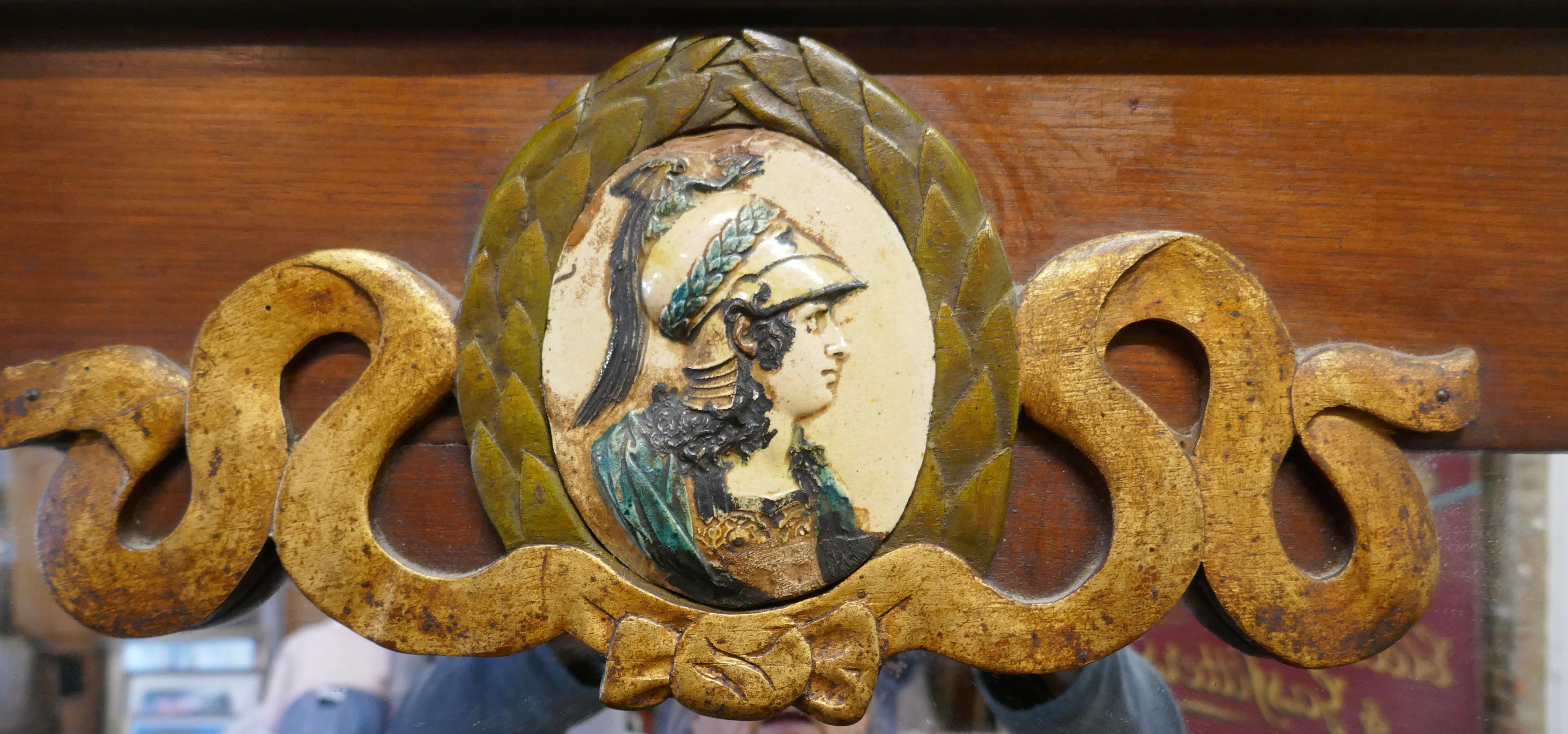 French republic mirror, 

The Mirror Frame is a rectangular shape made in mahogany, in the centre at the top we have wood carving with a painted cartouche of Marianne (the personification of Liberty) at the centre
The mirror has more decoration